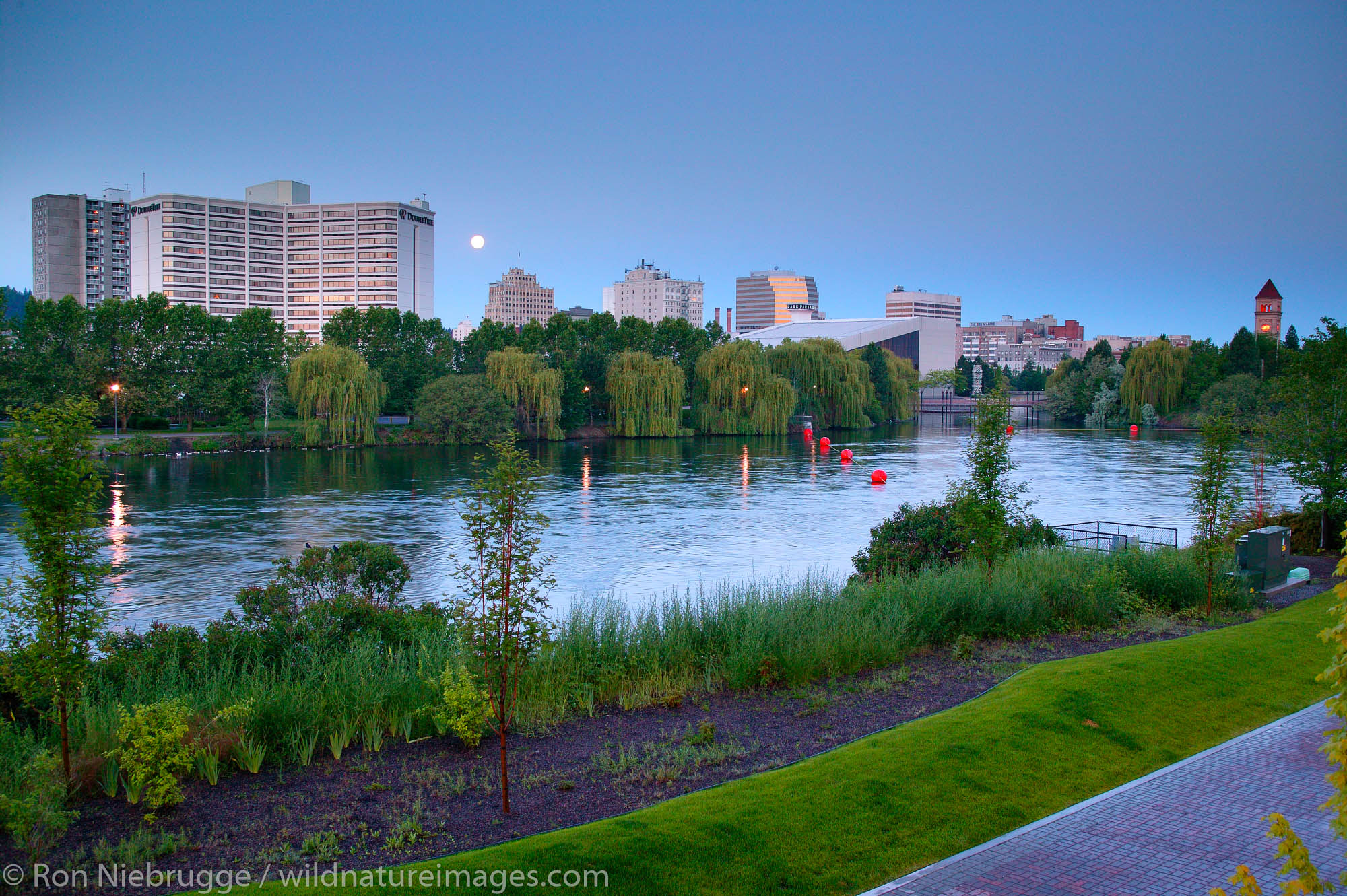 Moonset over the Spokane River and Riverfront Park, Spokane, Washington.