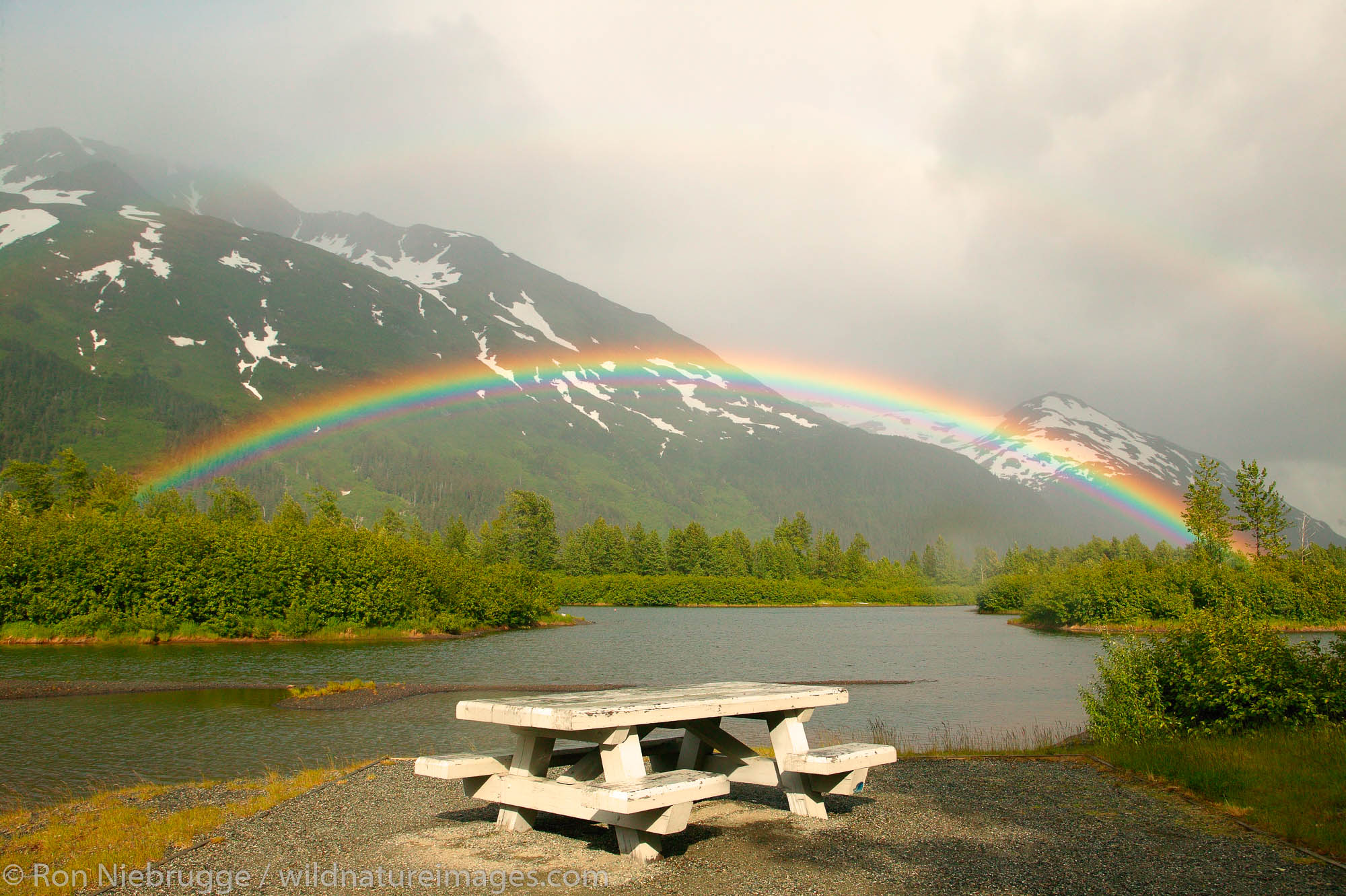 Rainbow over small lake and picnic area Portage Valley, Alaska.