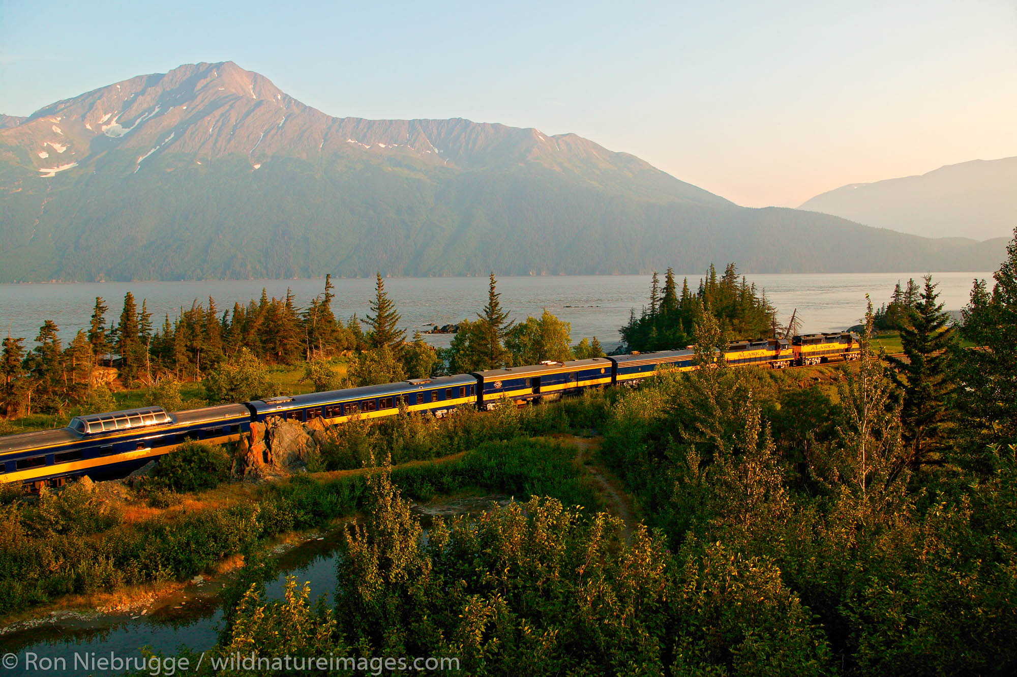 Alaska Railroad travels along Turnagain Arm on its way between Seward and Anchorage, Alaska.