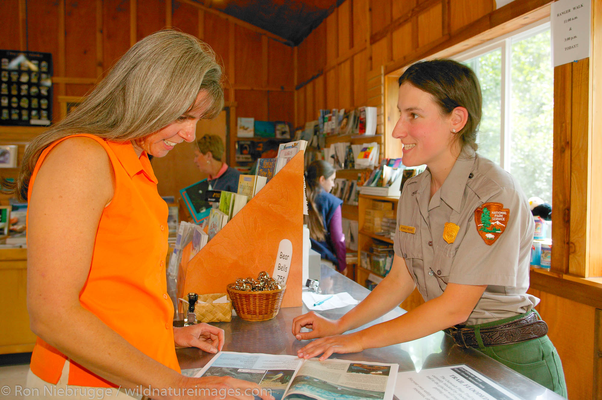 Janine Niebrugge being helped Park employee Bonnie Moore at the Exit Glacier Nature Center, Kenai Fjords National Park, Seward...