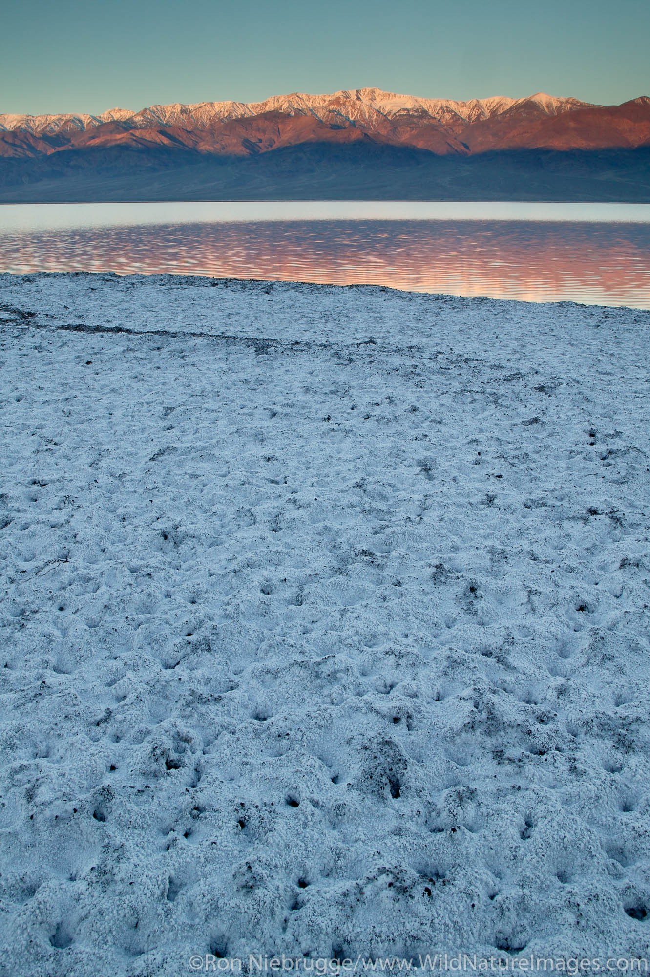 Water from heavy rains fill the Badwater Basin into a lake in 2005.  Death Valley National Park, California.
