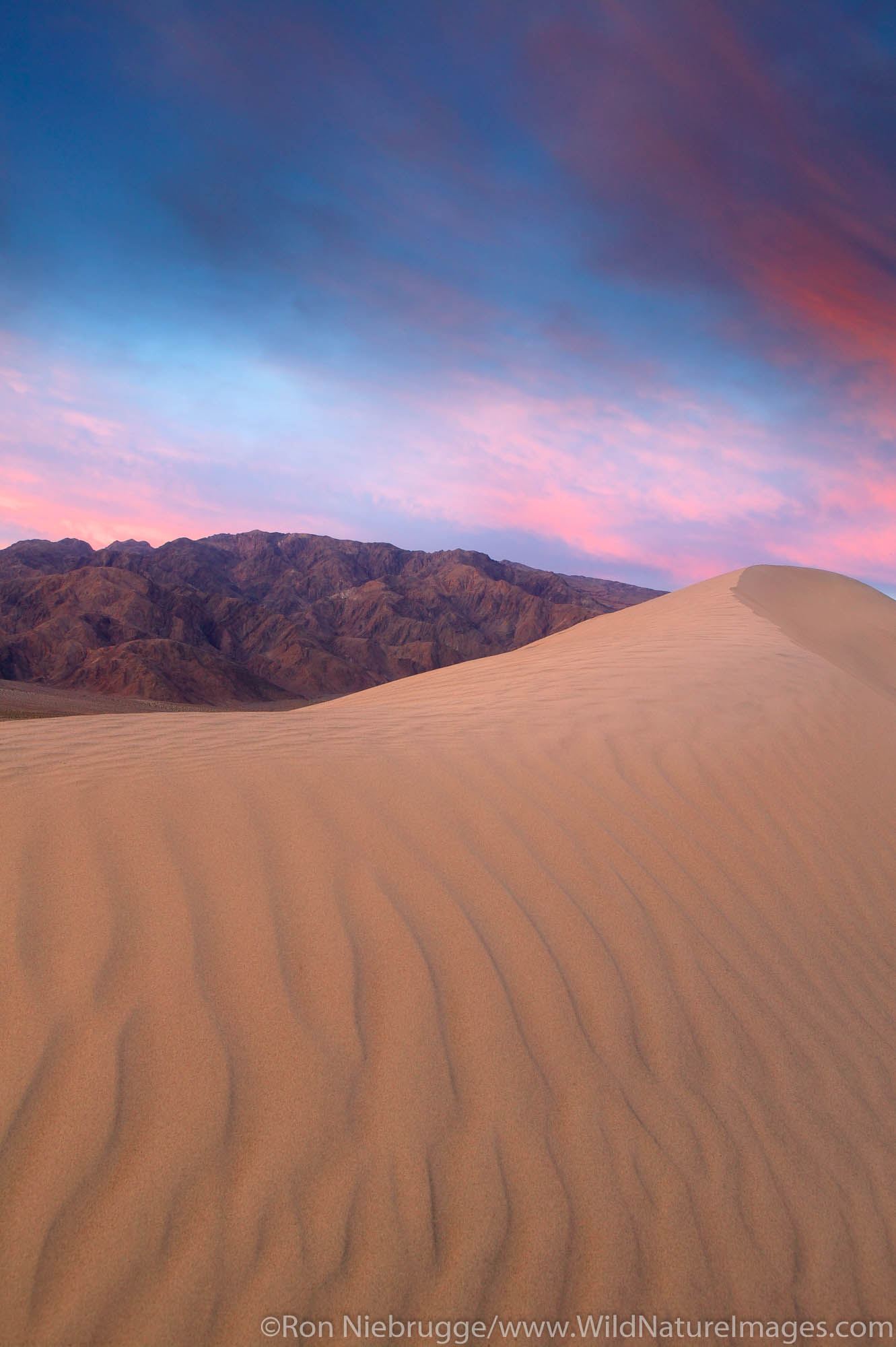 Sand dunes near Stovepipe Wells and Tucki Mountain of the Panamint Range, Death Valley National Park, California.