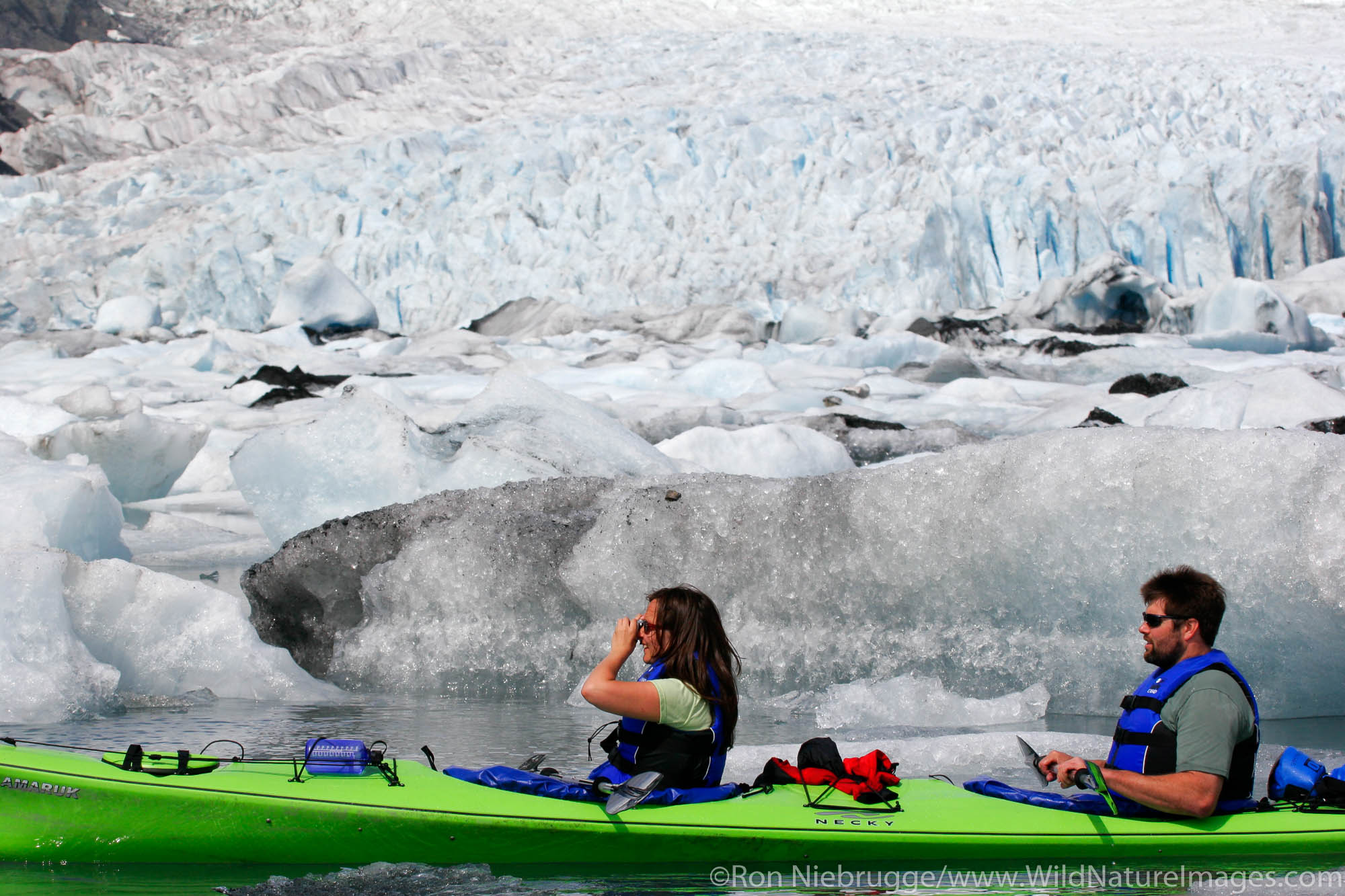 Kayaking in Pedersen Lagoon, Kenai Fjords National Park, Alaska. (model released)