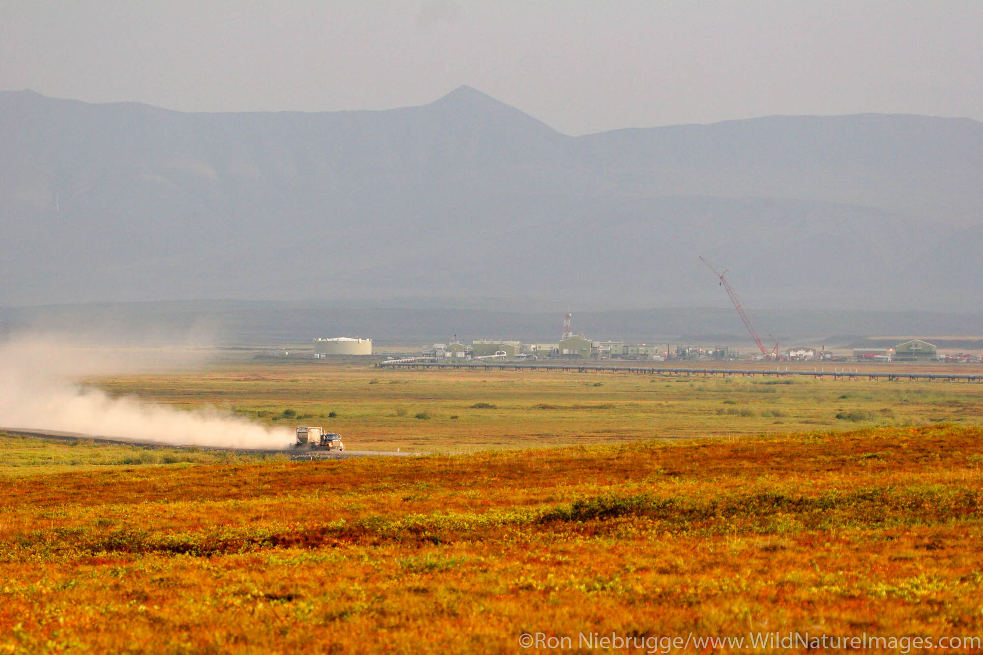 A truck goes by pump Station 3 of the Alaska Pipeline, from the Dalton Highway, Alaska.