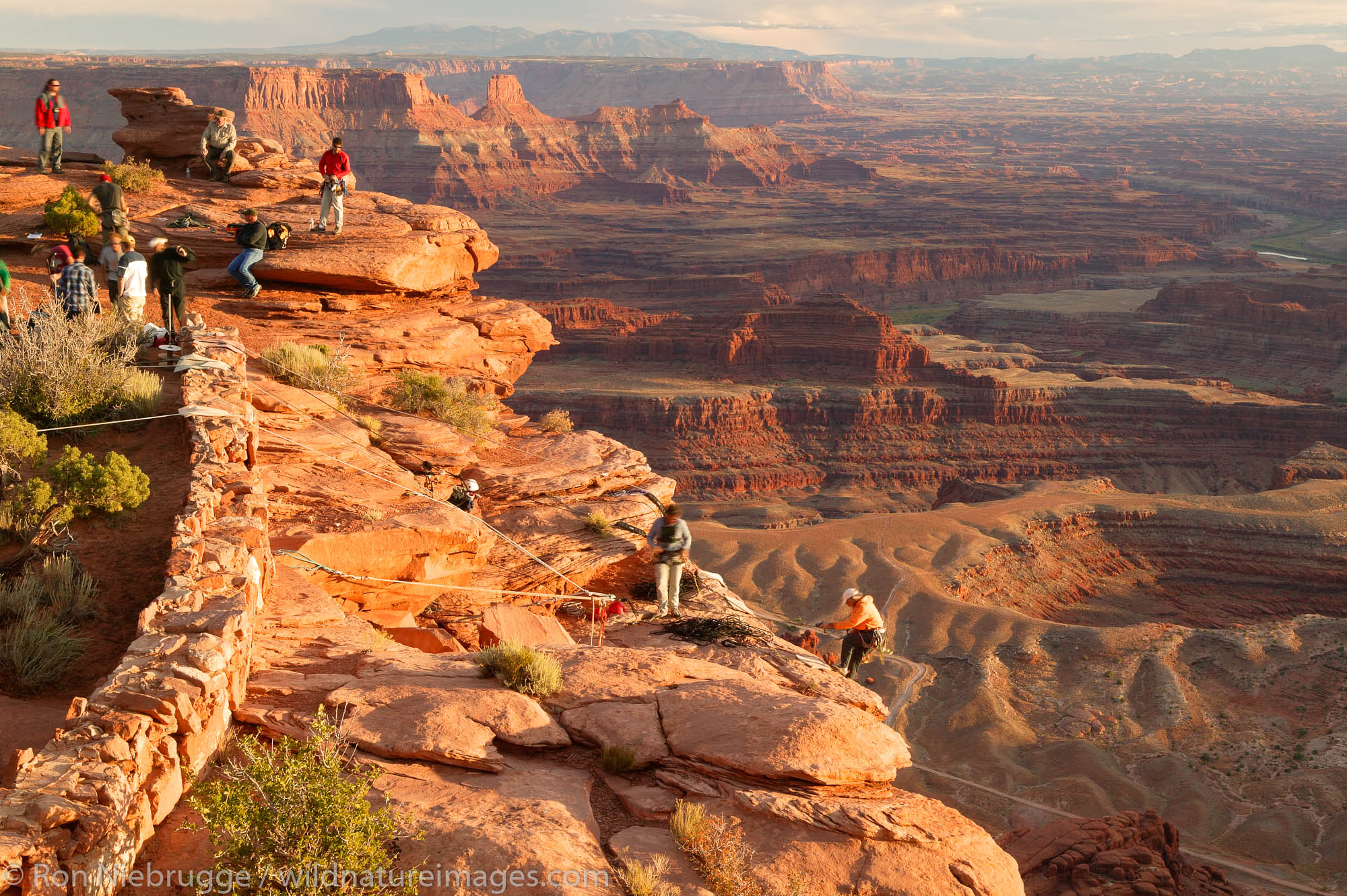 Rock climbers at the Dead Horse Point Overlook take part in a commercial shoot, Dead Horse Point State Park, near Moab, Utah.