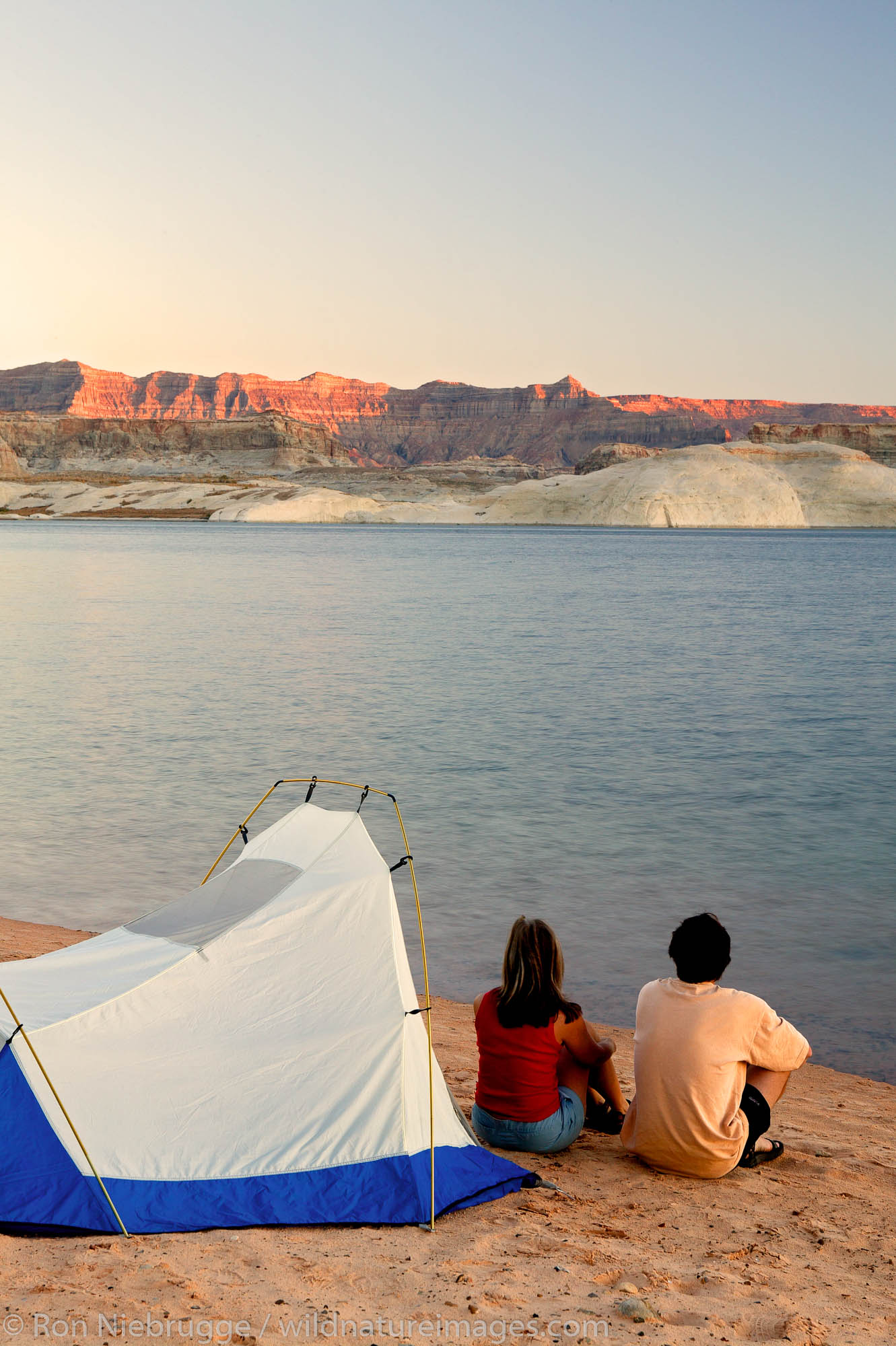 Visitors tent camping at the Lone Rock Primitive Campground, Lake Powell and the Glenn Canyon Recreation Area, Utah.  This is...