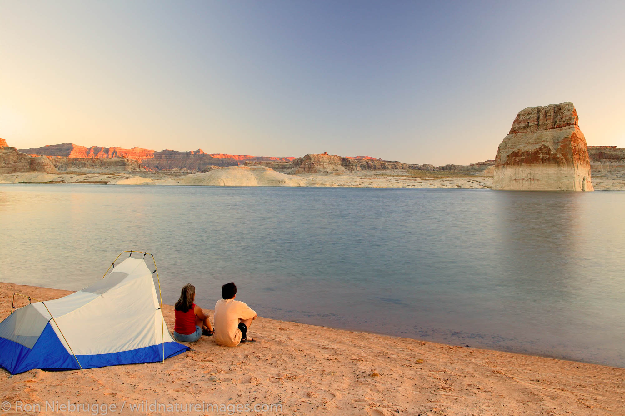 Visitors tent camping at the Lone Rock Primitive Campground, Lake Powell and the Glenn Canyon Recreation Area, Utah.  This is...