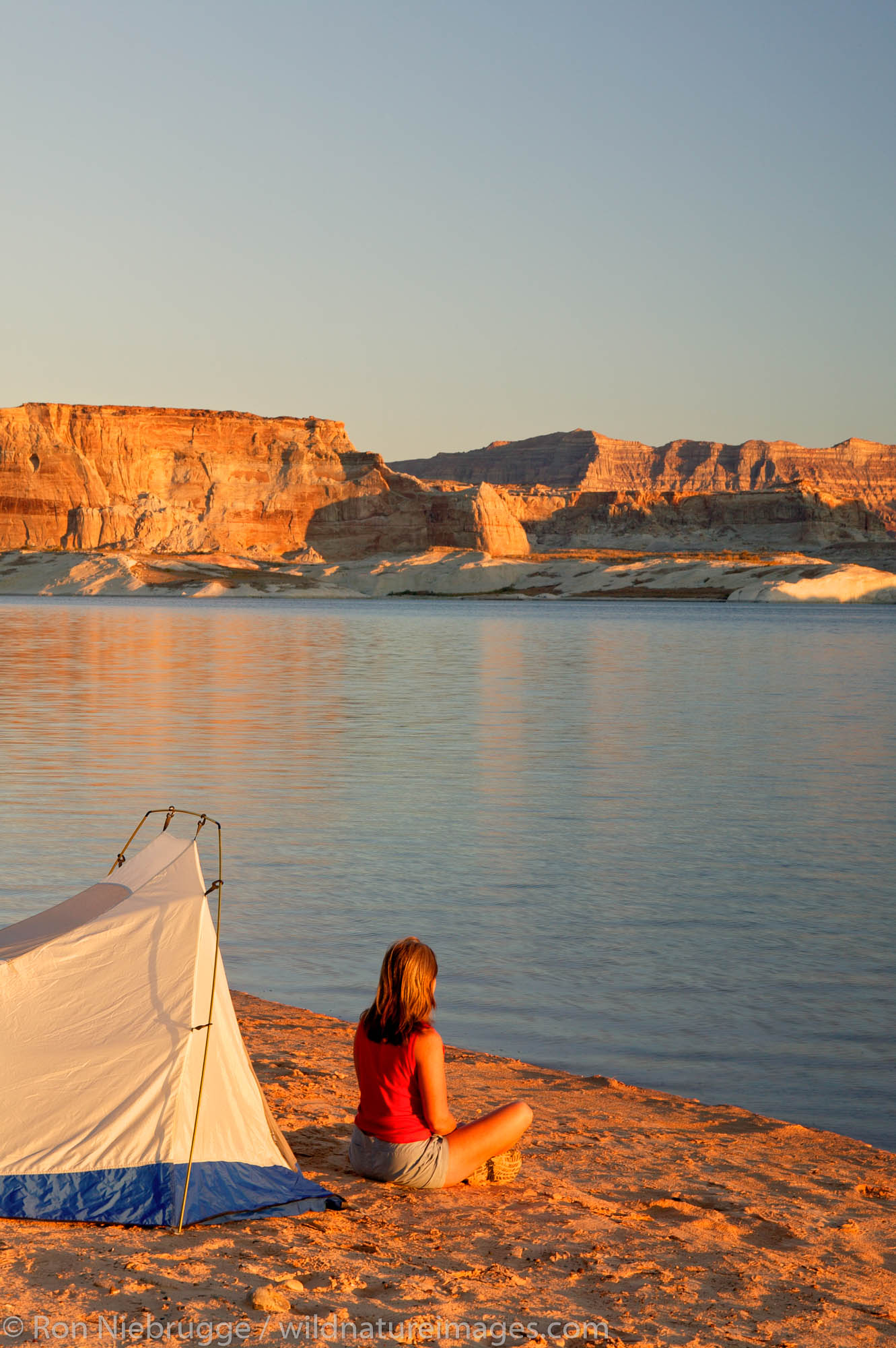 Visitors tent camping at the Lone Rock Primitive Campground, Lake Powell and the Glenn Canyon Recreation Area, Utah.  This is...