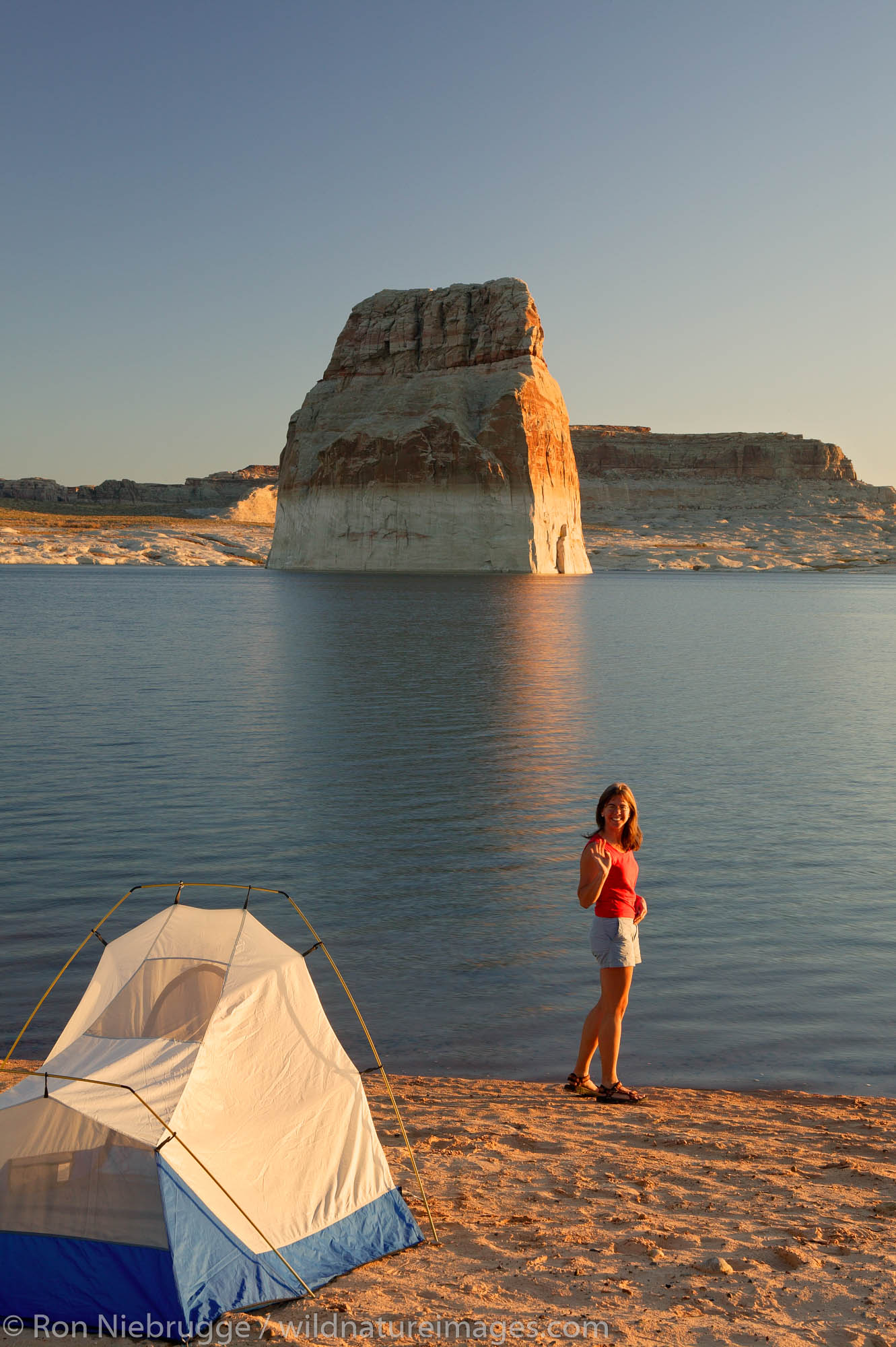 Visitors tent camping at the Lone Rock Primitive Campground, Lake Powell and the Glenn Canyon Recreation Area, Utah.  This is...