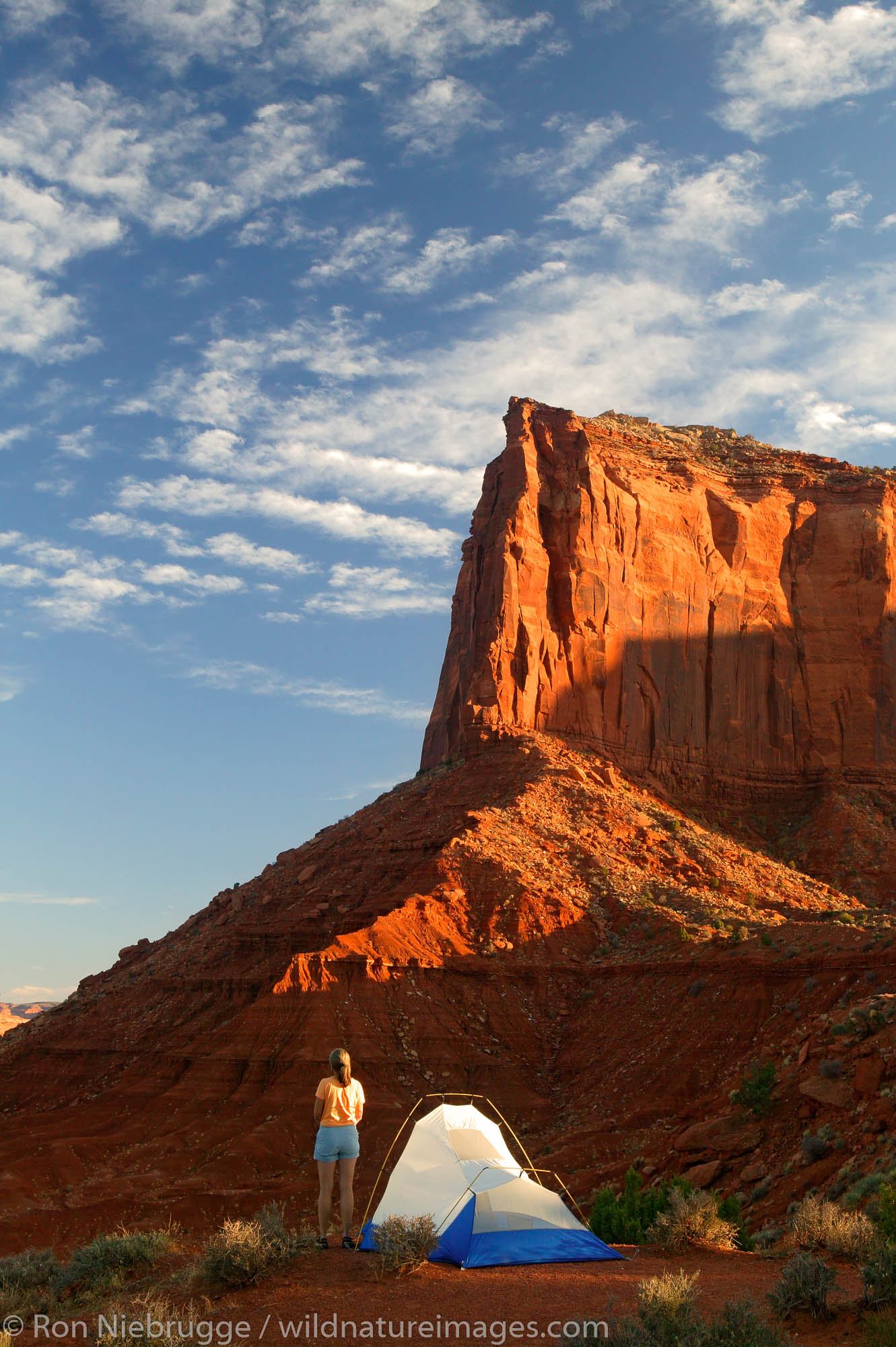 A visitor enjoys the view from camp of Monument Valley Navajo Tribal Park, Utah.  (model released)