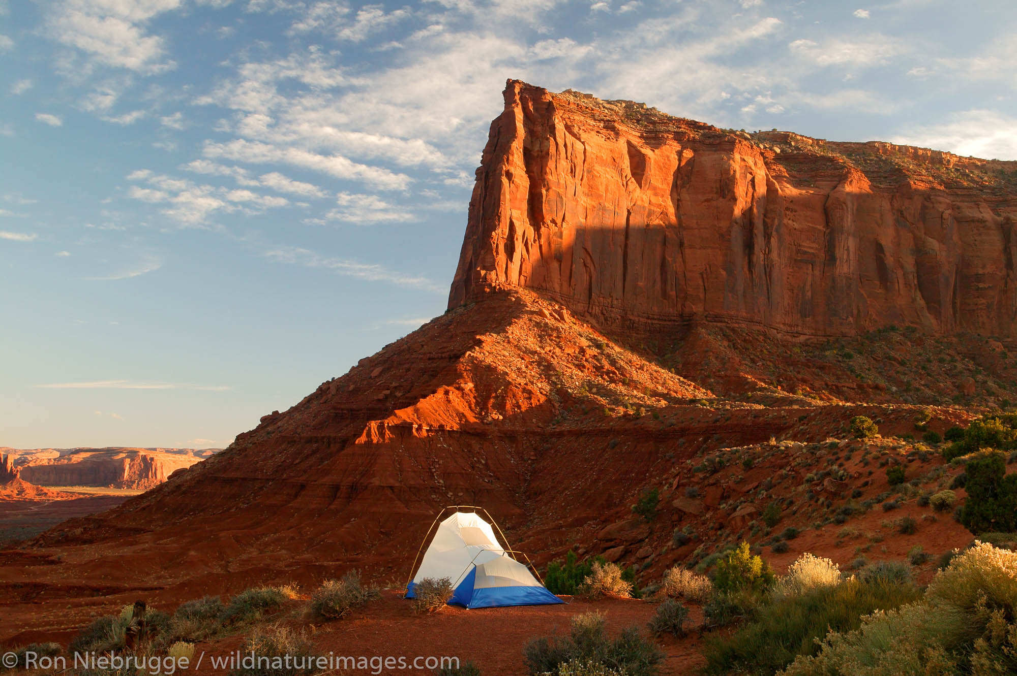 A visitor enjoys the view from camp of Monument Valley Navajo Tribal Park, Utah.  (model released)