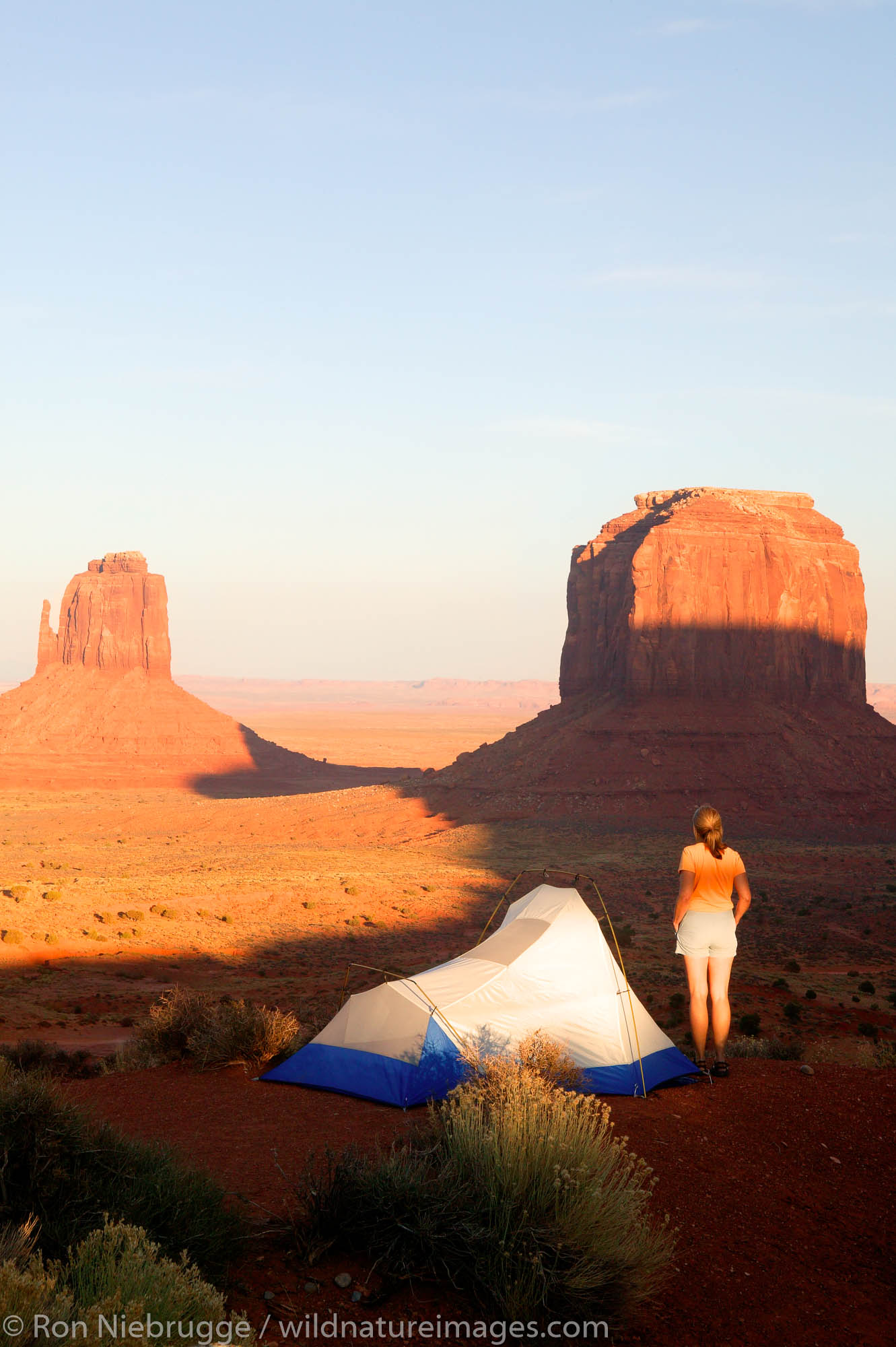 A visitor enjoys the view from camp of Monument Valley Navajo Tribal Park, Utah.  (model released)