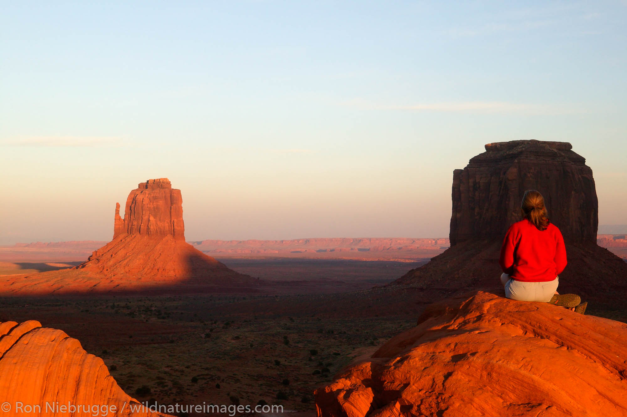 A visitor enjoys the view of Monument Valley Navajo Tribal Park, Utah.  (Model released)