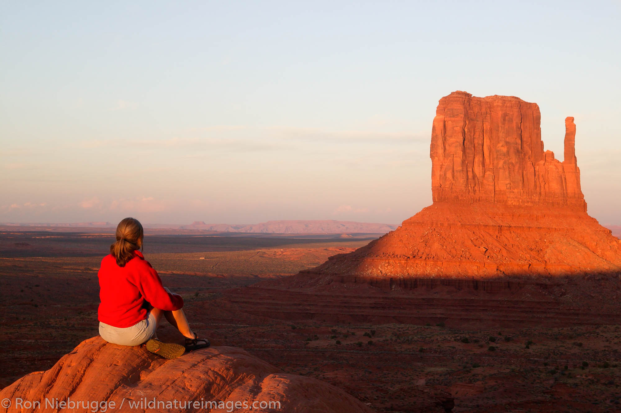 A visitor enjoys the view of Monument Valley Navajo Tribal Park, Utah.  (Model released)