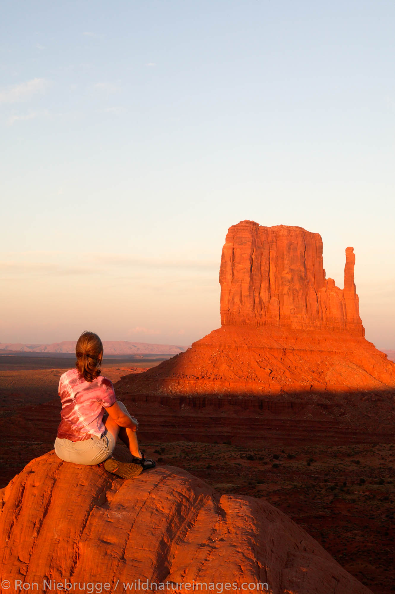 A visitor enjoys the view of Monument Valley Navajo Tribal Park, Utah.  (Model released)