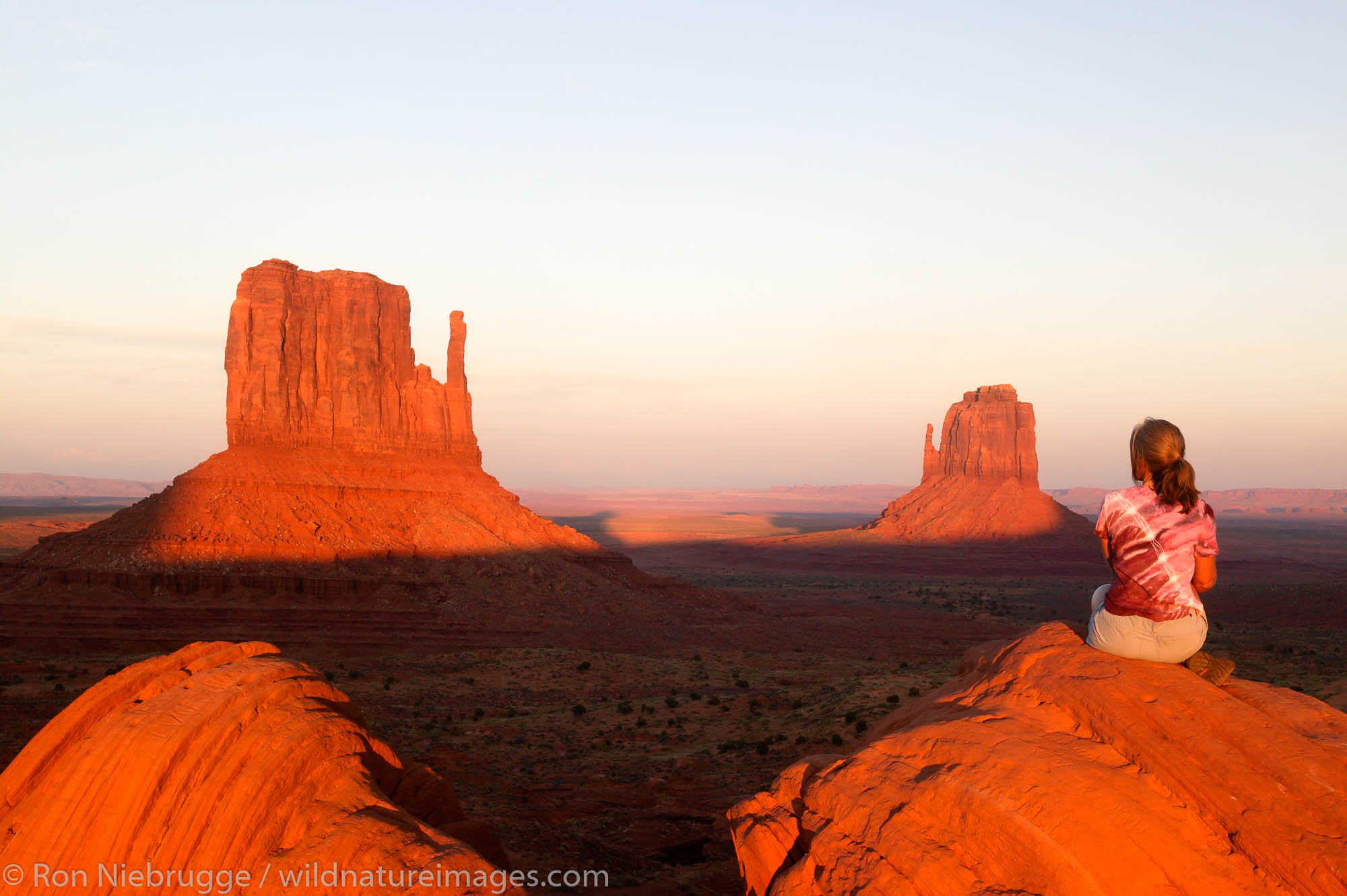 A visitor enjoys the view of Monument Valley Navajo Tribal Park, Utah.  (Model released)