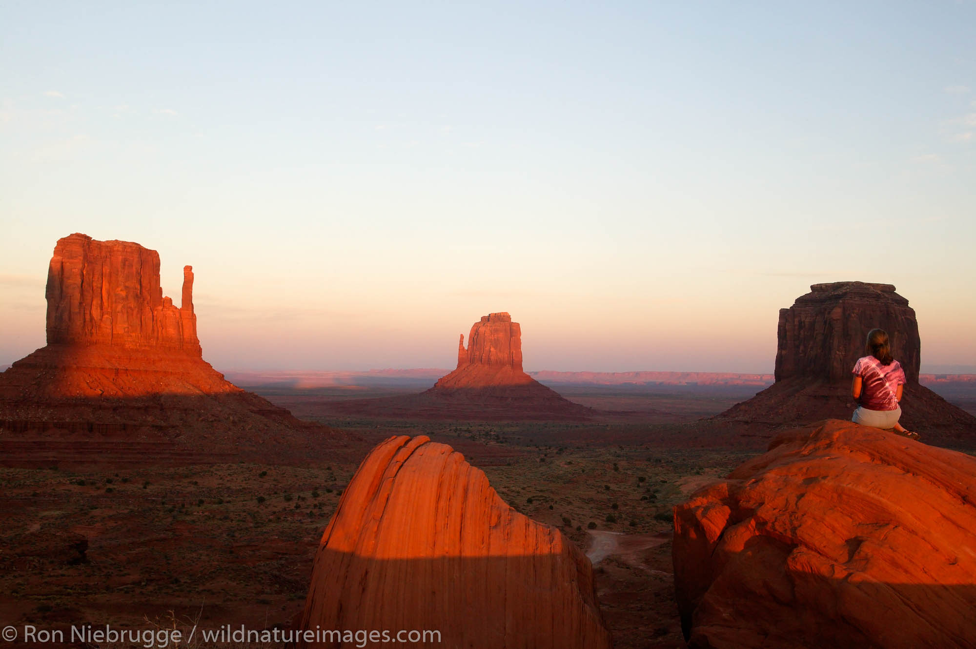 A visitor enjoys the view of Monument Valley Navajo Tribal Park, Utah.  (Model released)