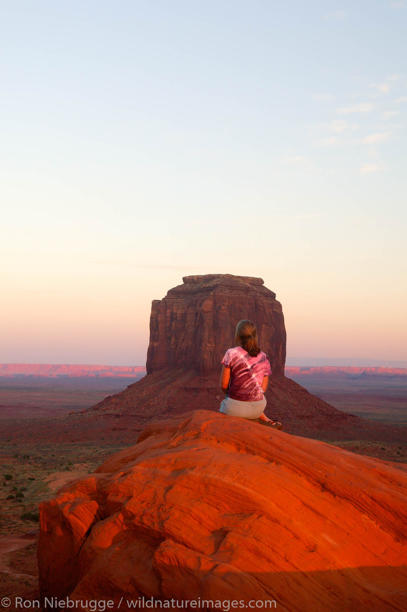 A visitor enjoys the view of Monument Valley Navajo Tribal Park, Utah.  (Model released)