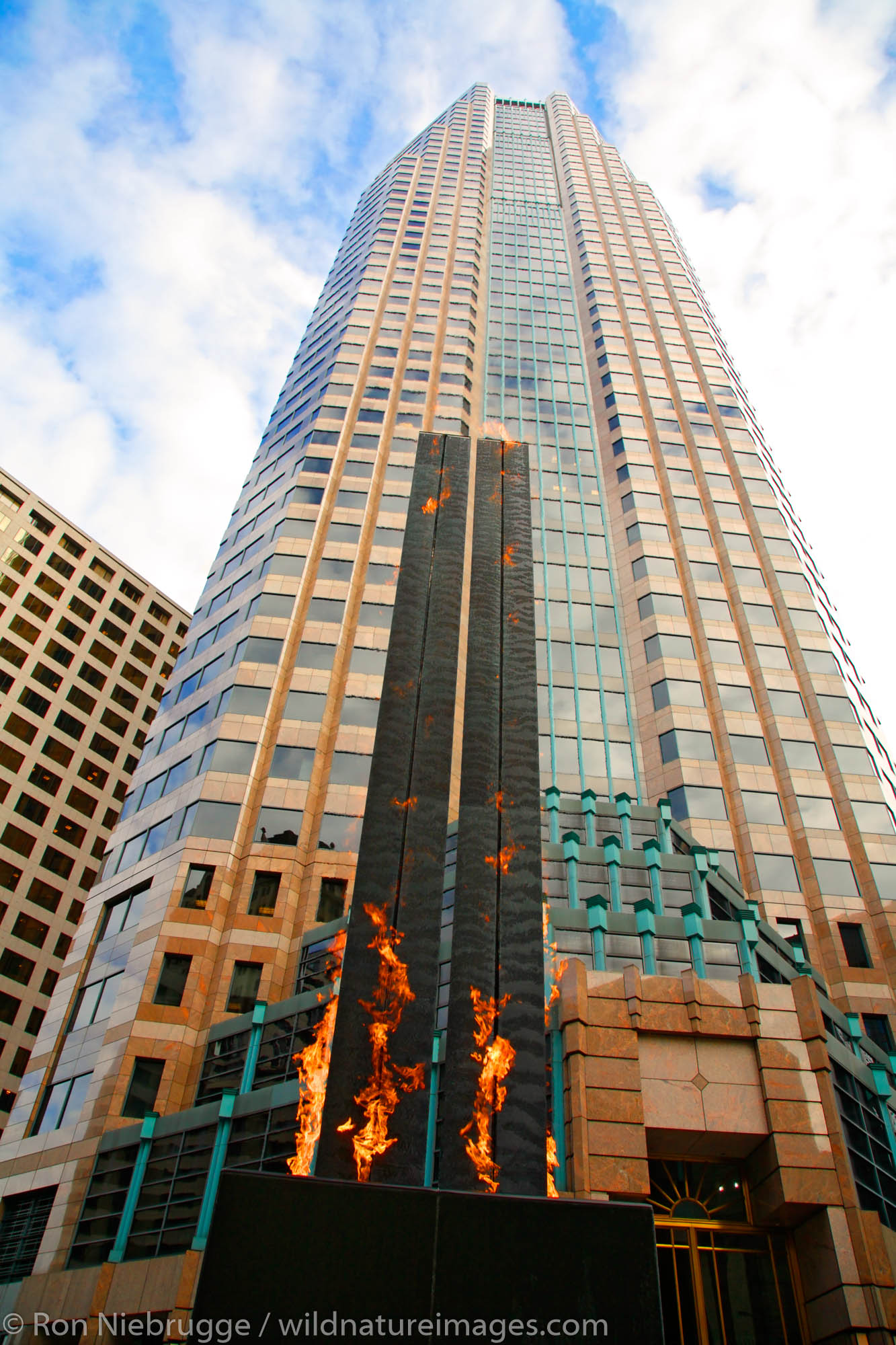 The flaming statue L.A. Prime Matter by Eric Orr in front of Figueroa at Wilshire, in downtown Los Angeles, California.