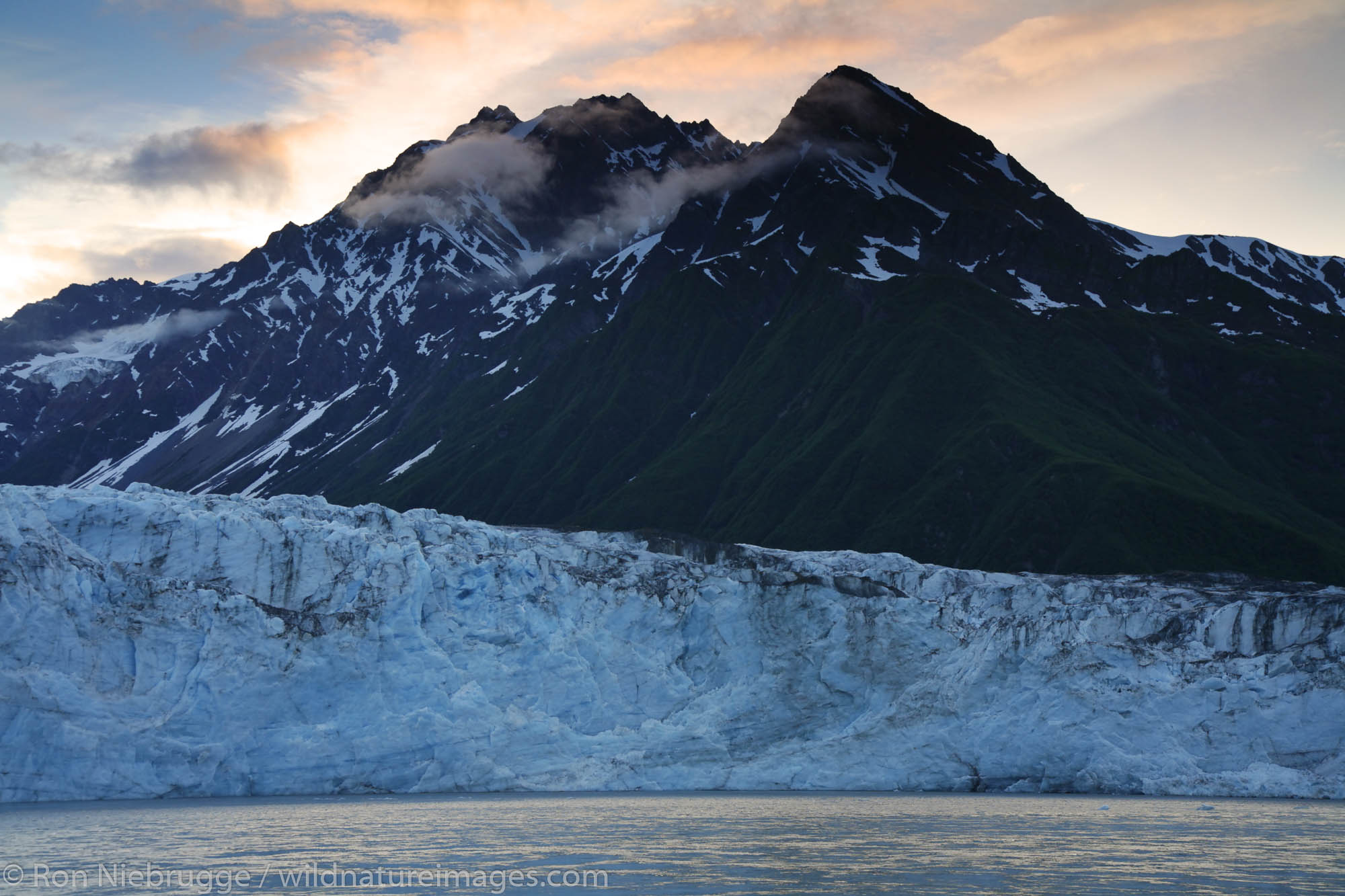 The Copper River passes in front of Childs Glacier, Cordova, Chugach National Forest, Alaska.