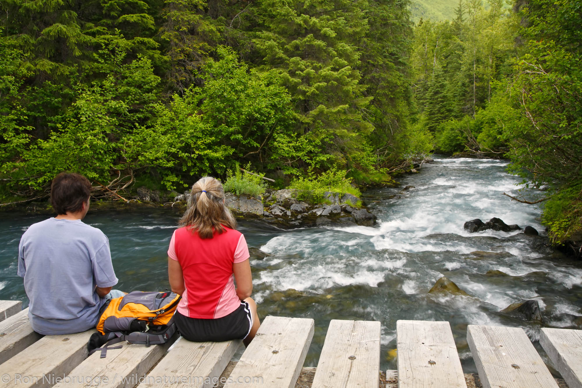 Hikers enjoy Winner Creek along the Winner Creek Gorge Trail, Girdwood, Chugach National Forest, Alaska. (MR)