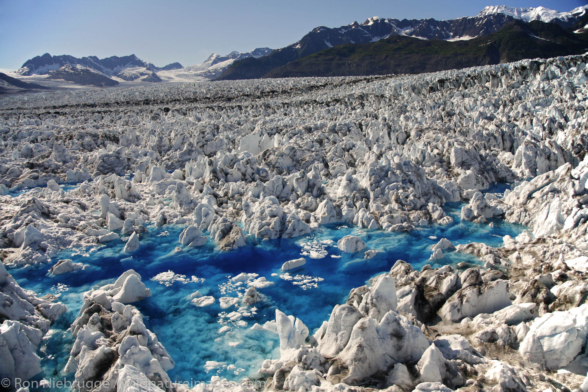 Aerial view of blue Meltwater pools on Columbia Glacier, Prince William Sound, Chugach National Forest, Alaska.