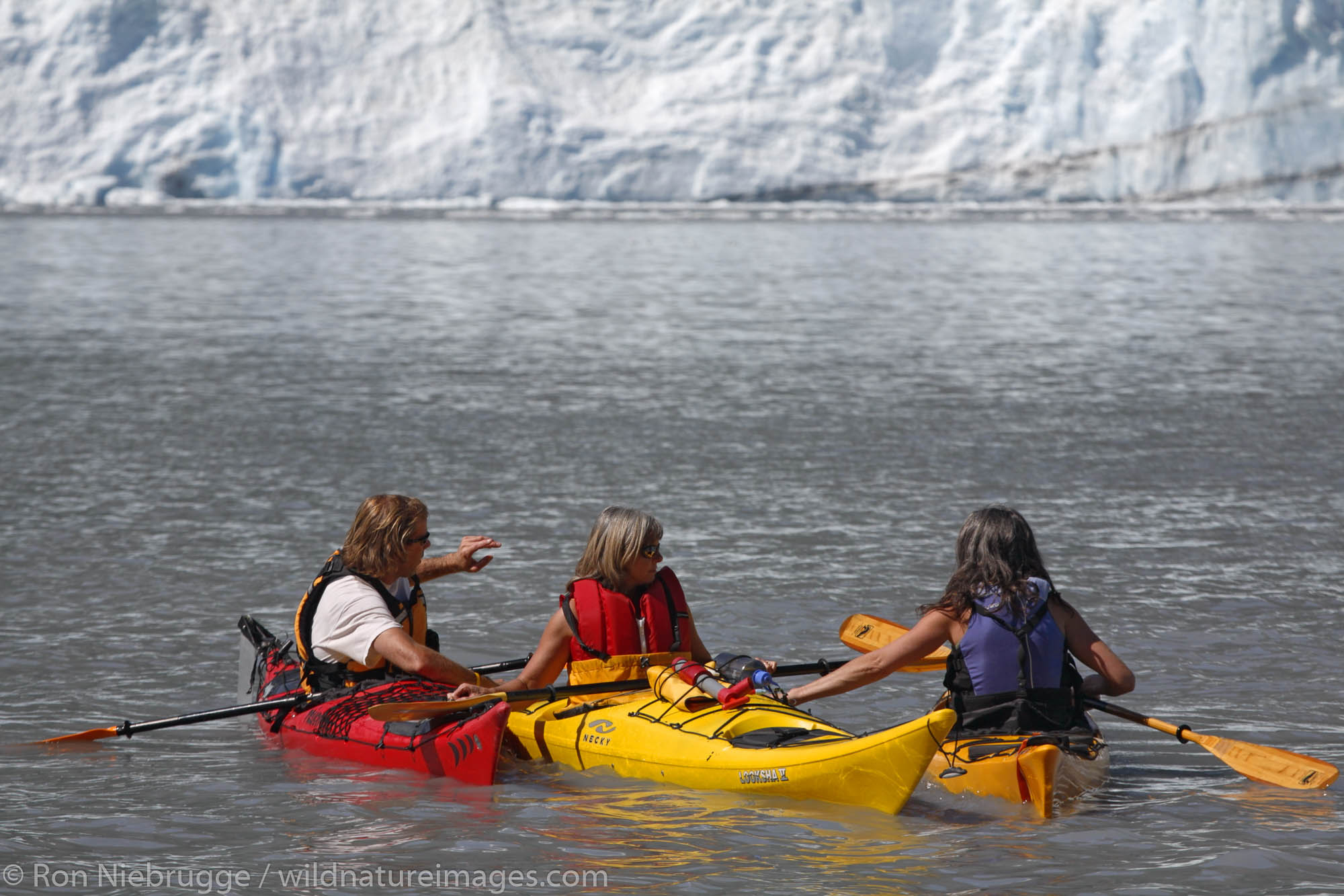 Kayaking in Harriman Fiord with Barry Glacier in background, Prince William Sound, Chugach National Forest, Alaska.