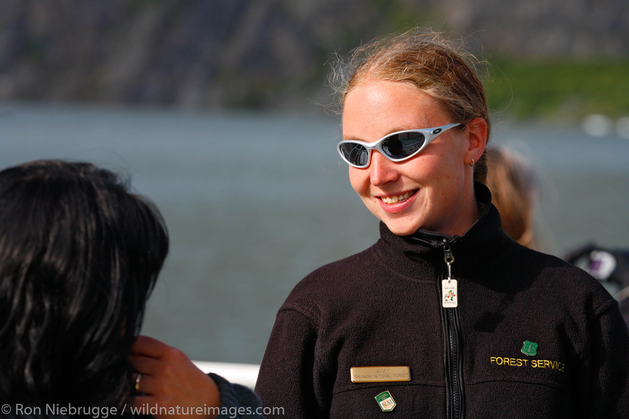 Forest Service Ranger and narrator on-board the M/V Ptarmigan Portage Glacier tour. Chugach National Forest, Alaska.