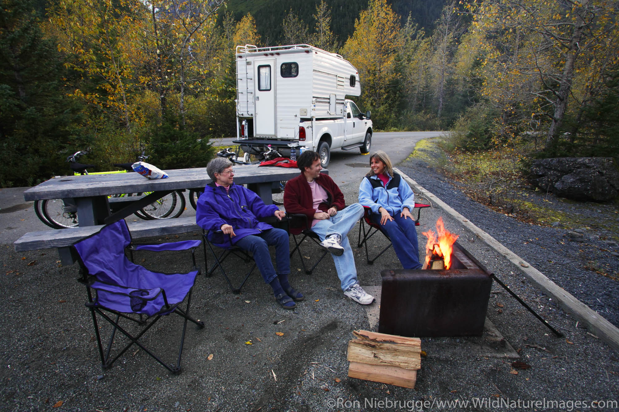 Sitting around the campfire at the Williwaw Campground, Portage Valley, Chugach National Forest, Alaska. (MR)