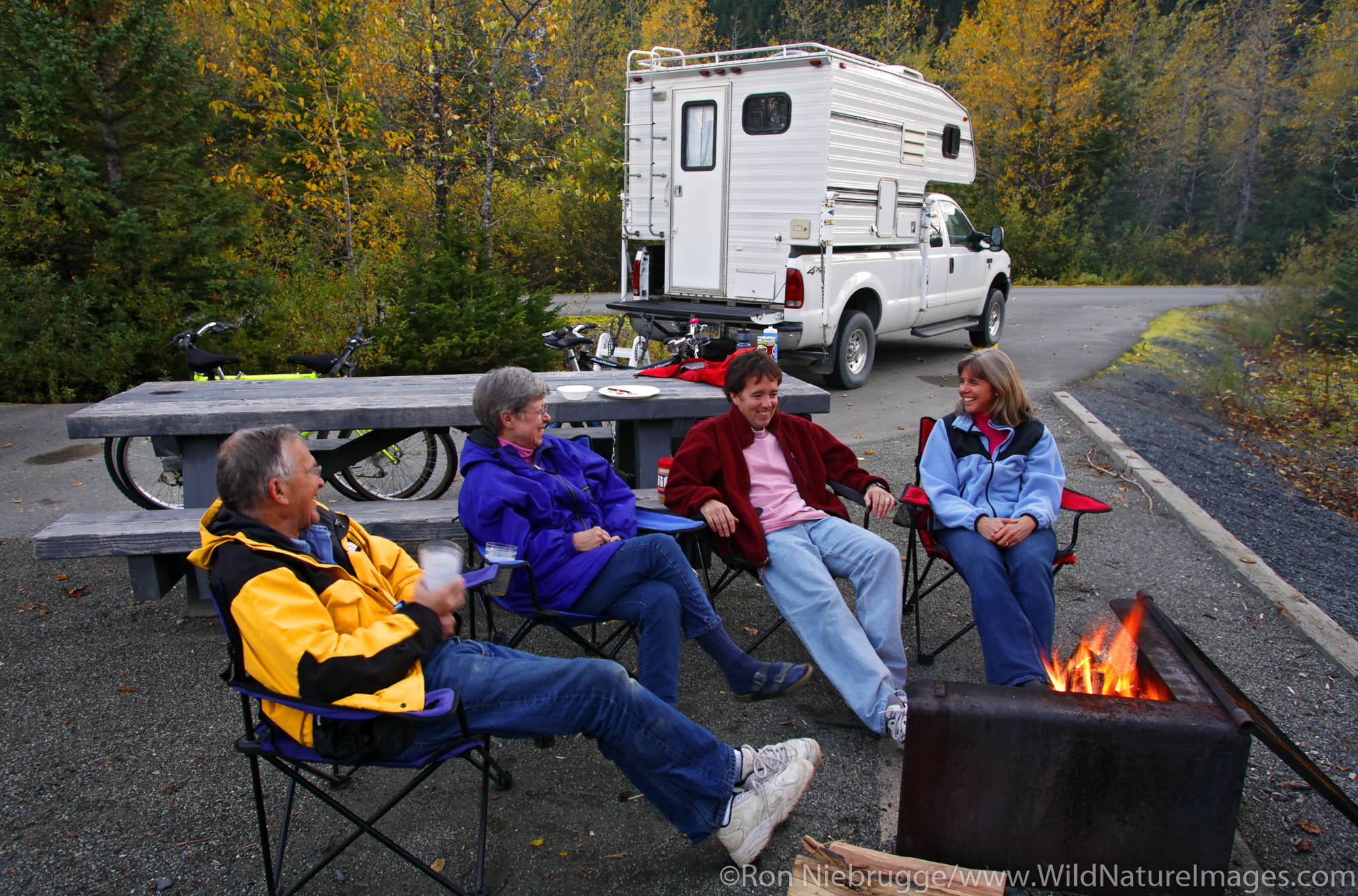 Sitting around the campfire at the Williwaw Campground, Portage Valley, Chugach National Forest, Alaska. (MR)
