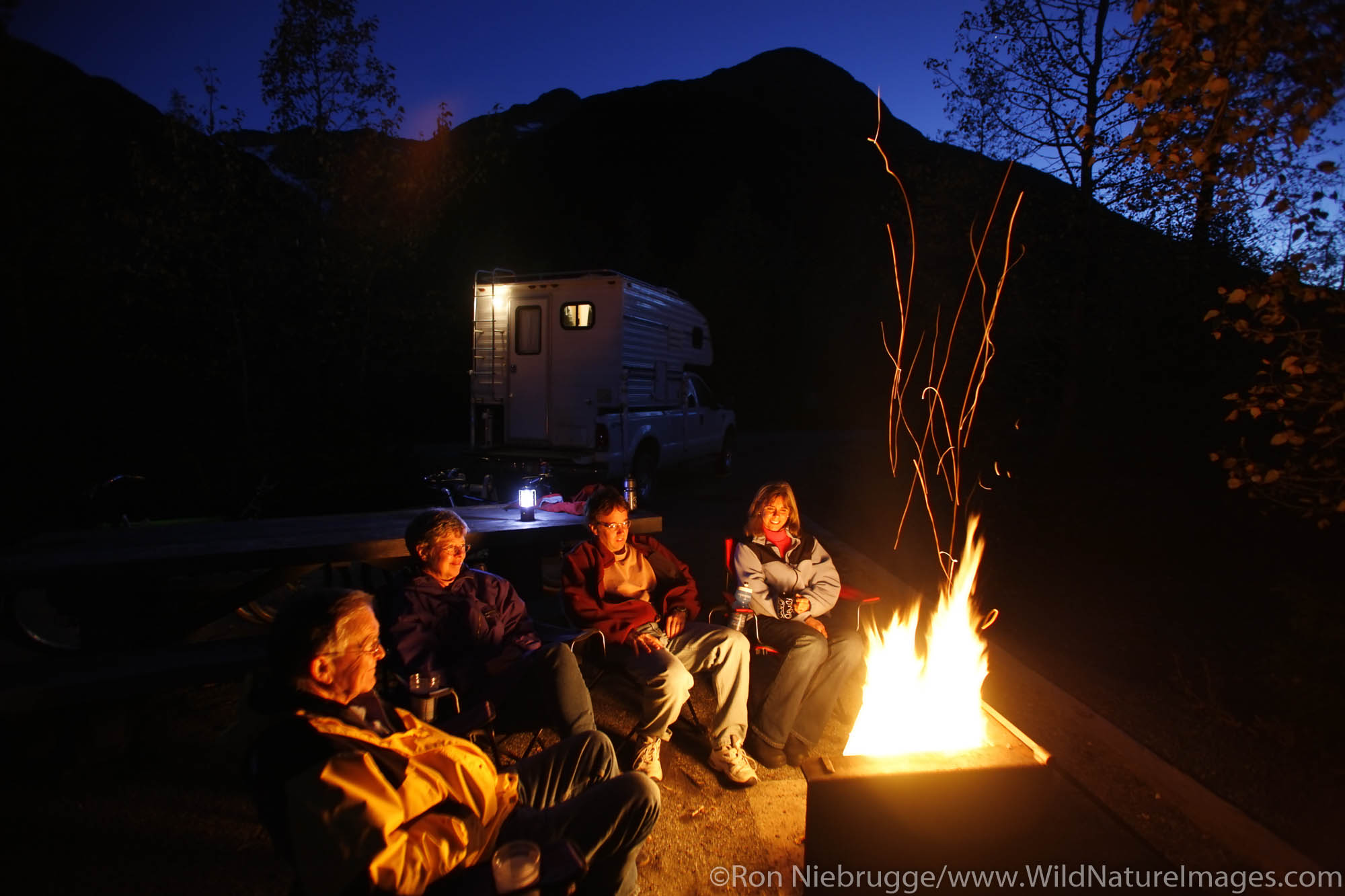 Sitting around the campfire at the Williwaw Campground, Portage Valley, Chugach National Forest, Alaska. (MR)