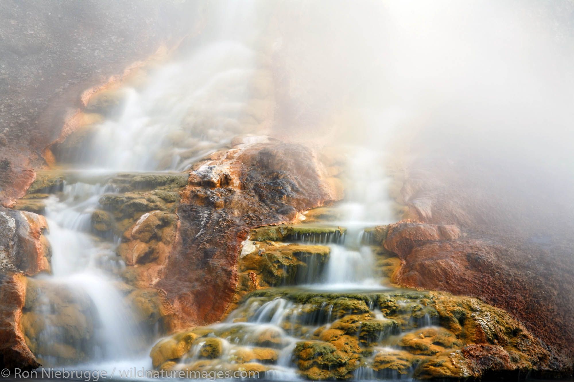 Water from the Grand Prismatic Spring flows into the Firehole River, Midway Geyser Basin, Yellowstone National Park, Wyoming.