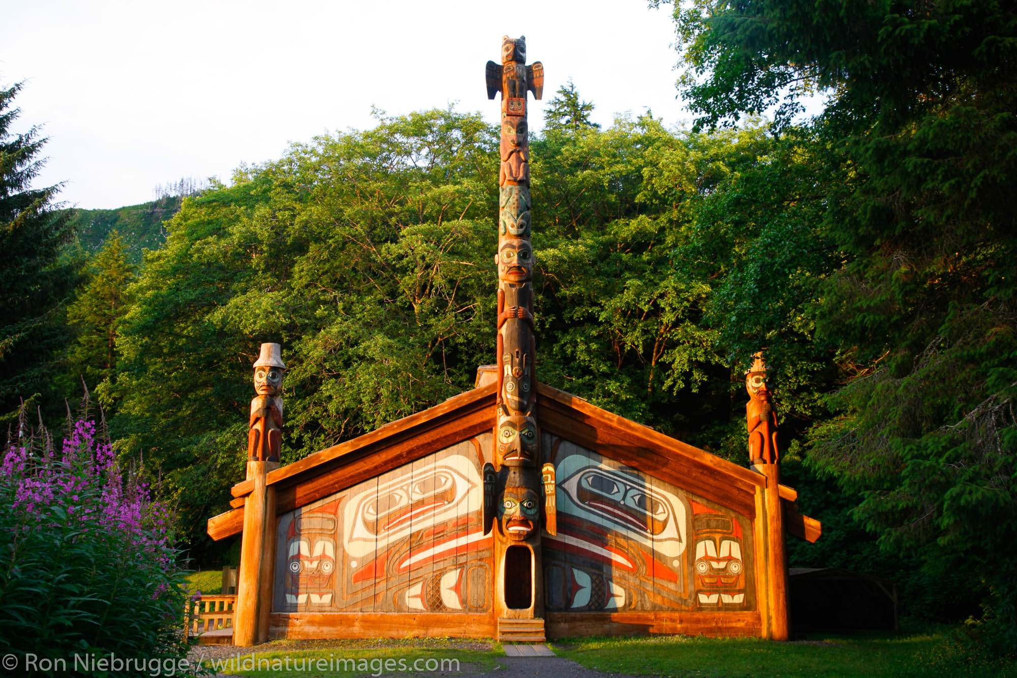 The Wandering Raven House Entrance Pole (pole 4) sits at the entrance to the Clan House, Totem Bight State Historical Park, Ketchikan...