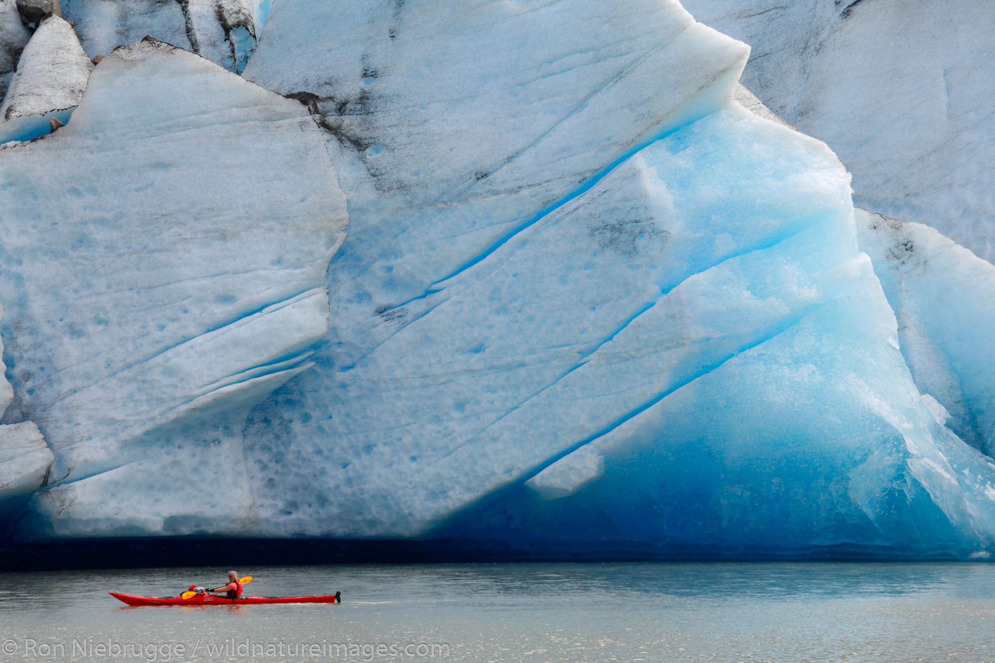 Kayaking in front of Mendenhall Glacier on Mendenhall Lake, Juneau, Alaska.