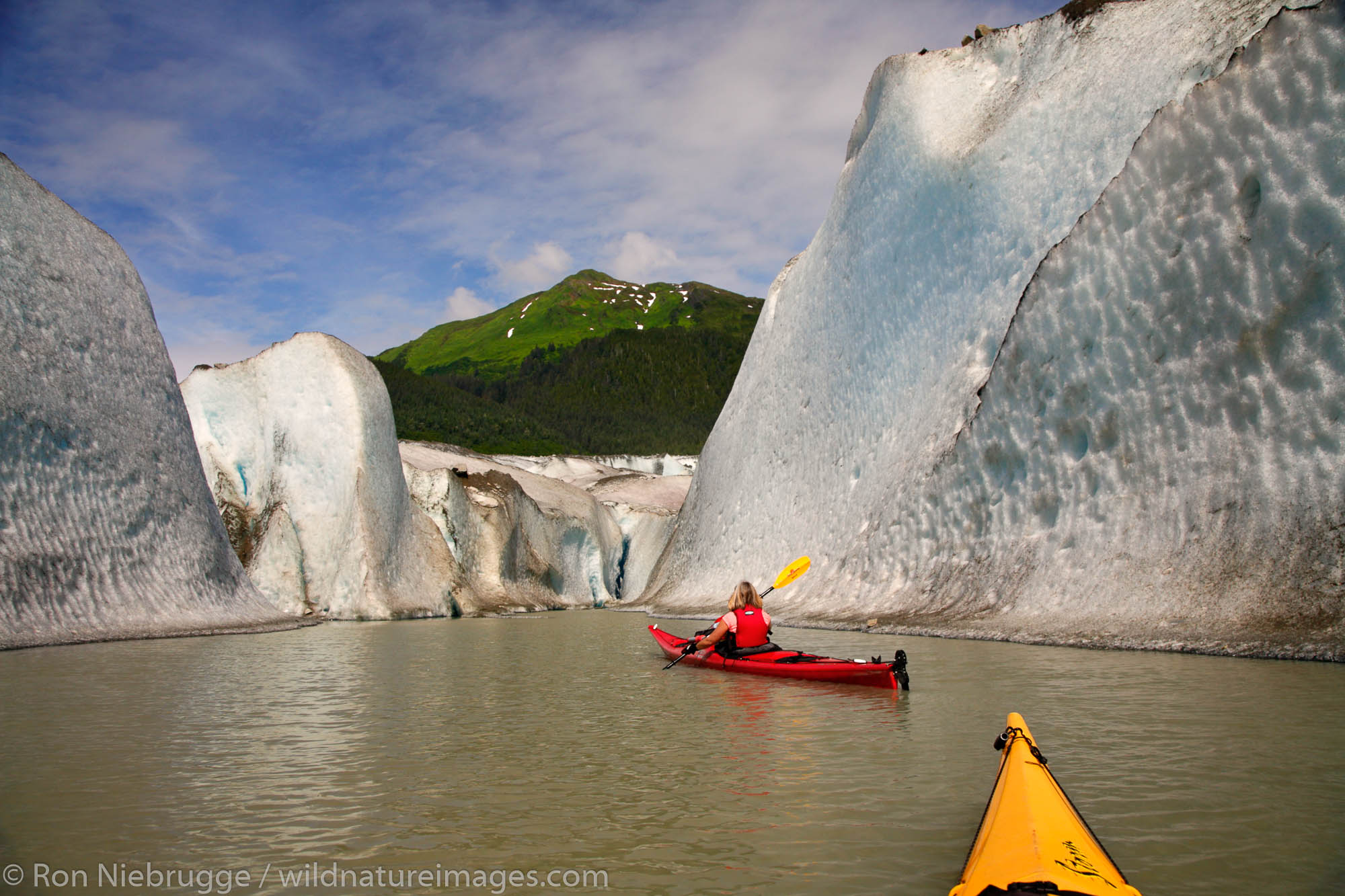 Kayaking in front of Mendenhall Glacier on Mendenhall Lake, Juneau, Alaska.