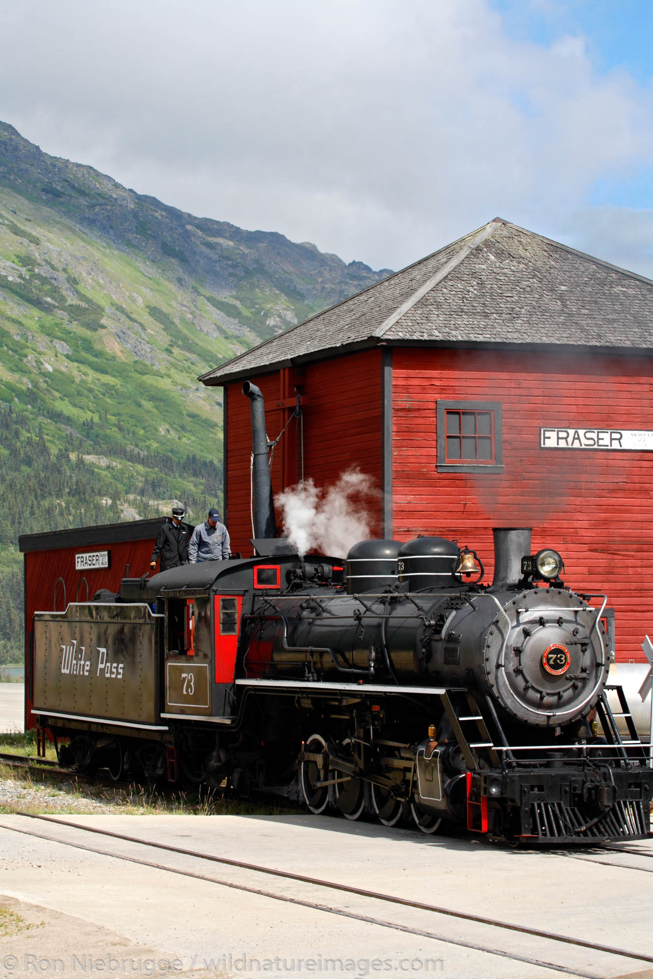 The historic steam engine number 73 gets water in Fraser, British Columbia Canada as part of the White Pass and Yukon Route railroad...