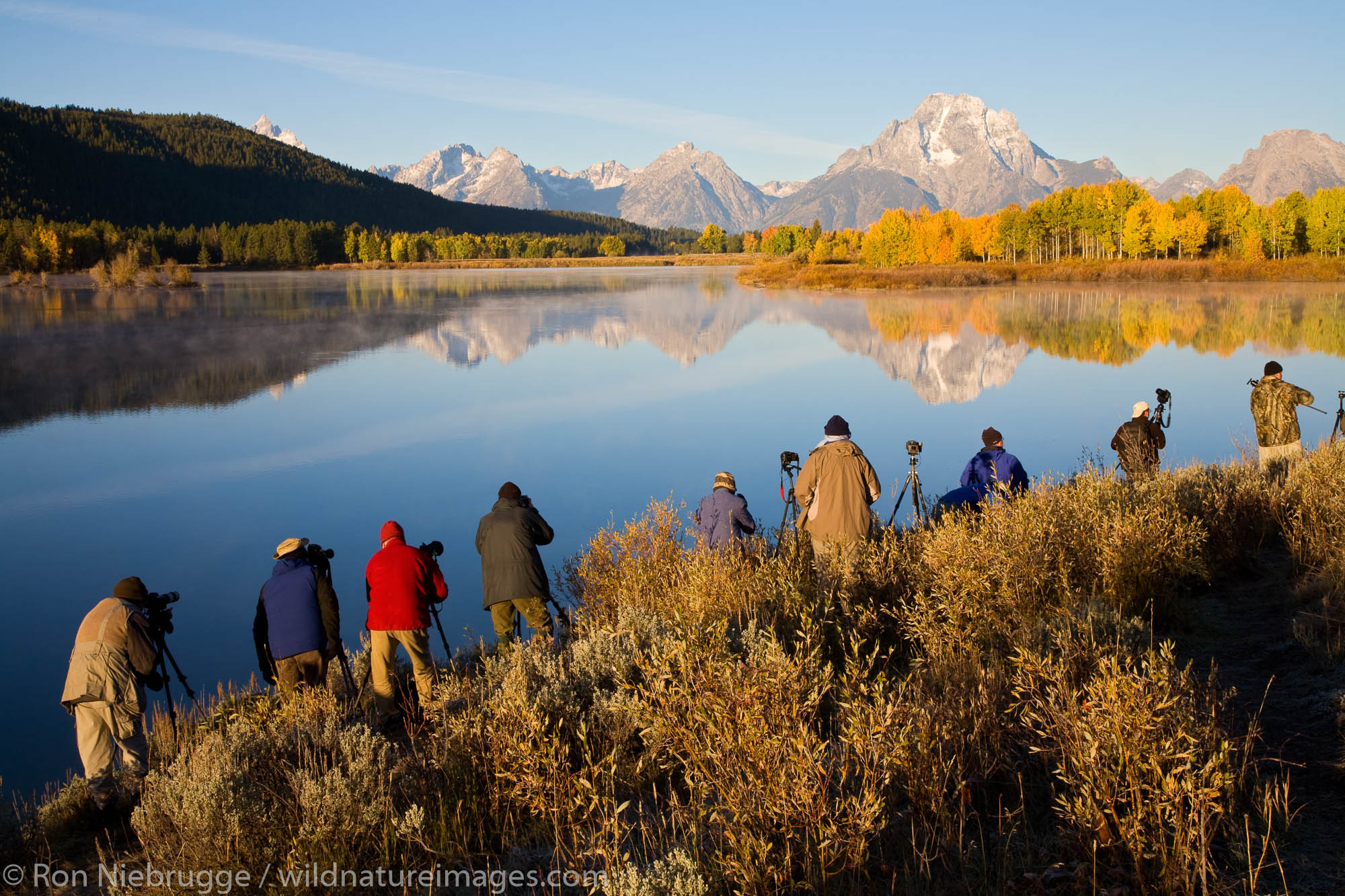 Photographers photographing Mount Moran from Oxbow Bend, Grand Teton National Park, Wyoming.
