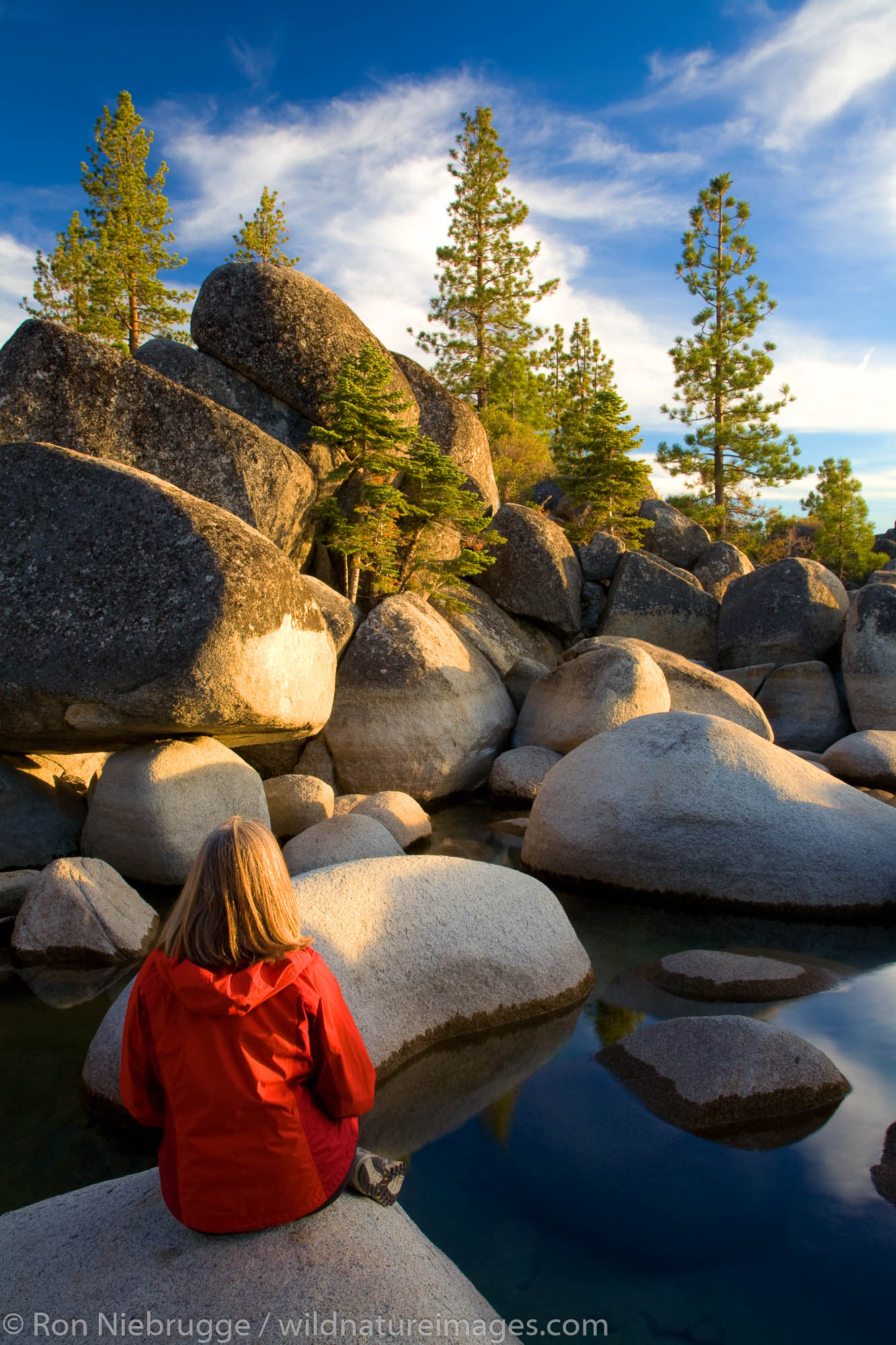 A visitor enjoys the rocky shoreline at Sand Harbor State Park, Lake Tahoe, Nevada.  (Model Released)