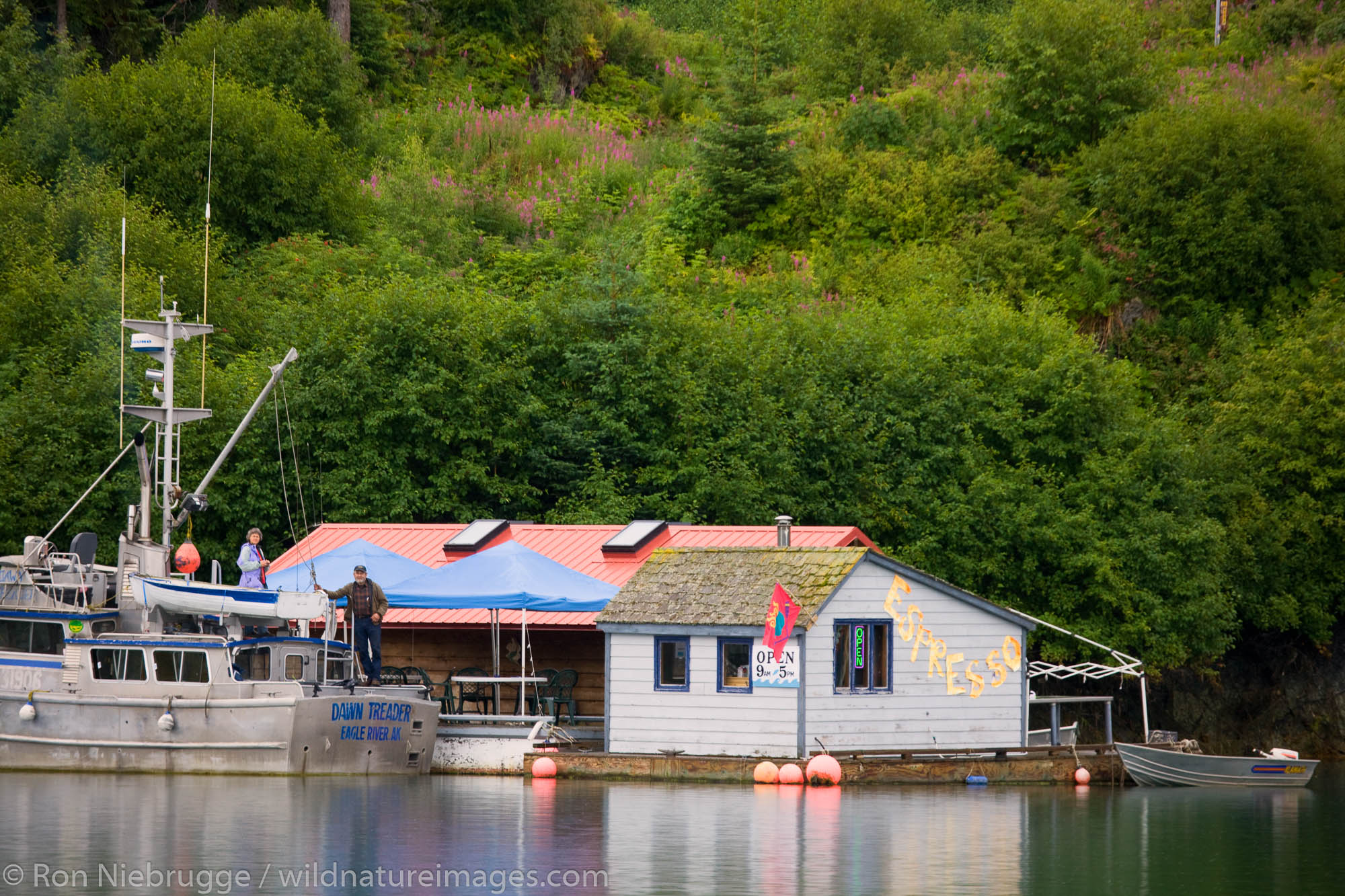 Customers at a floating Espresso stand, Halibut Cove, Kachemak Bay near Homer, Alaska.