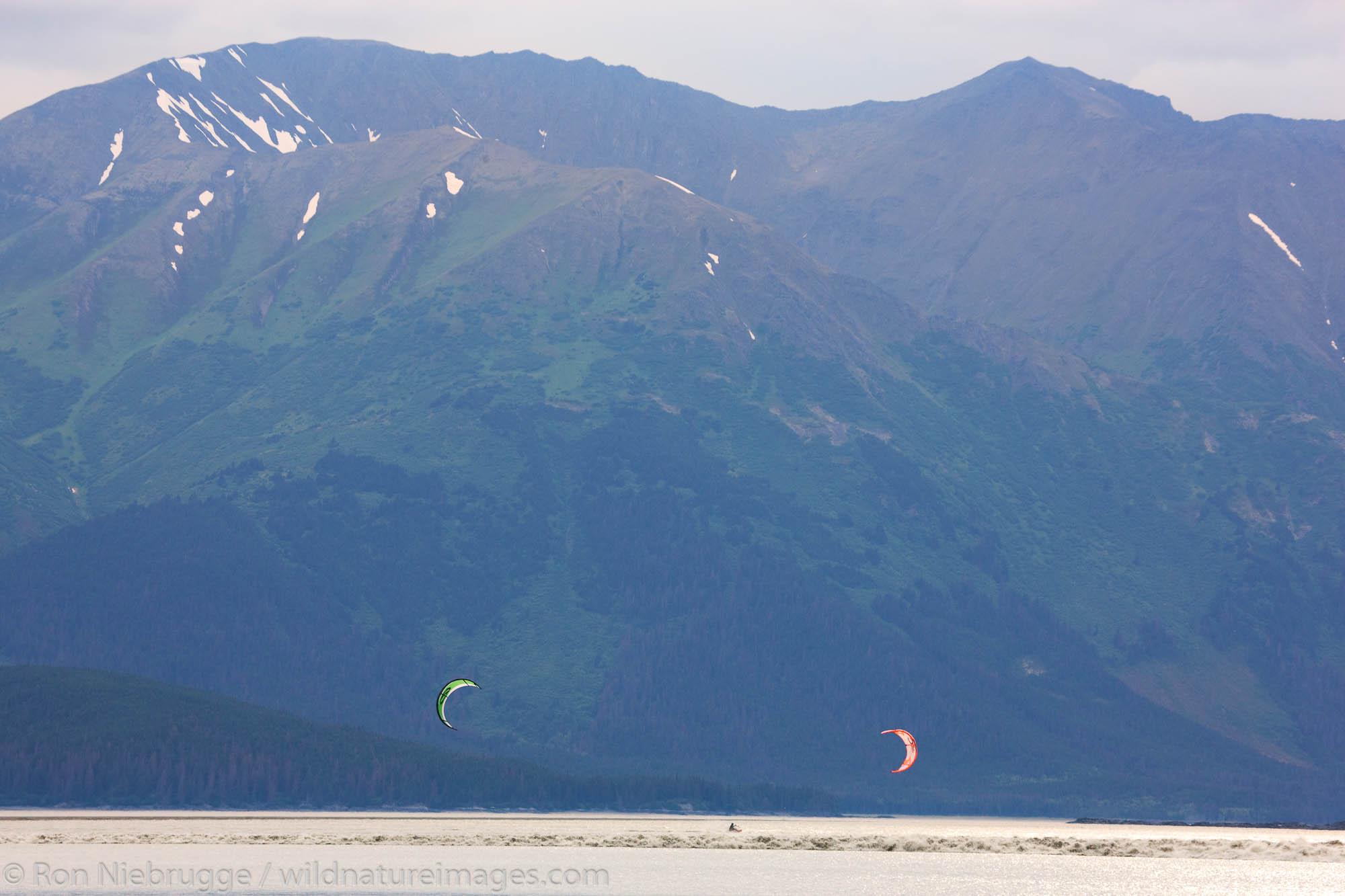 Troy and Mark kiteboarding the Bore Tide on Turnagain Arm, near Anchorage, Alaska.