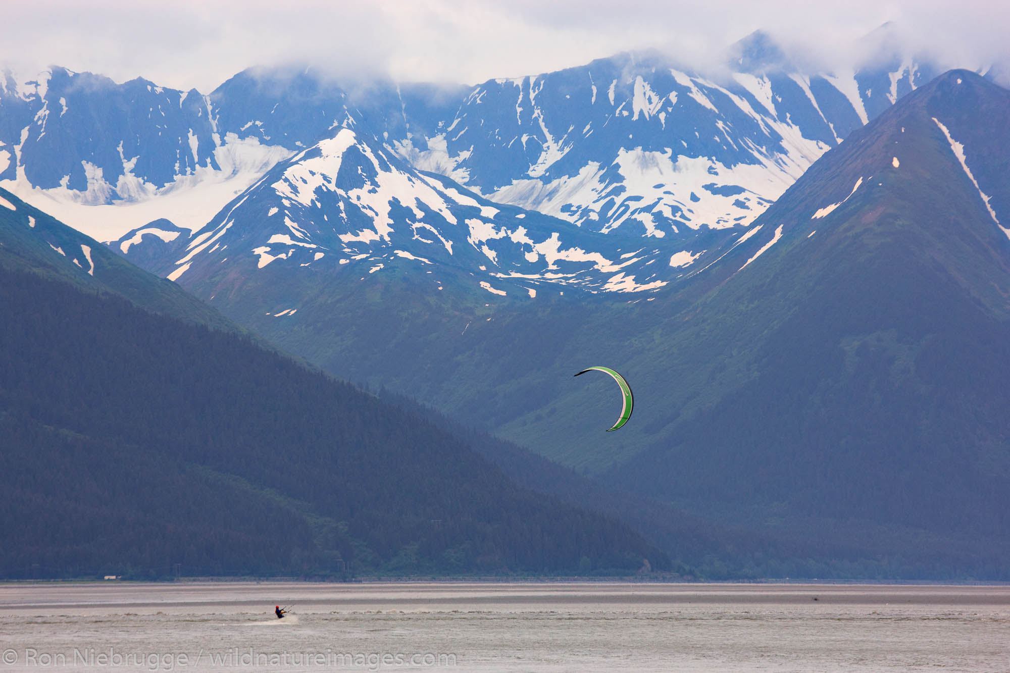 Troy and Mark kiteboarding the Bore Tide on Turnagain Arm, near Anchorage, Alaska.
