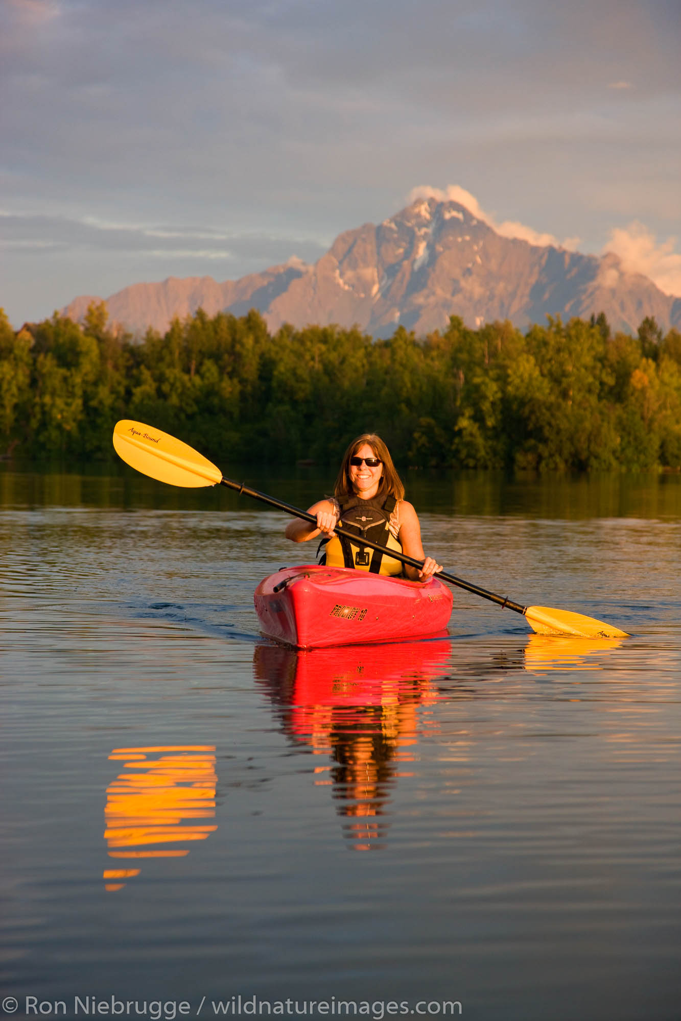 Kayaking on Finger Lake, Wasilla, Alaska.  (model released)