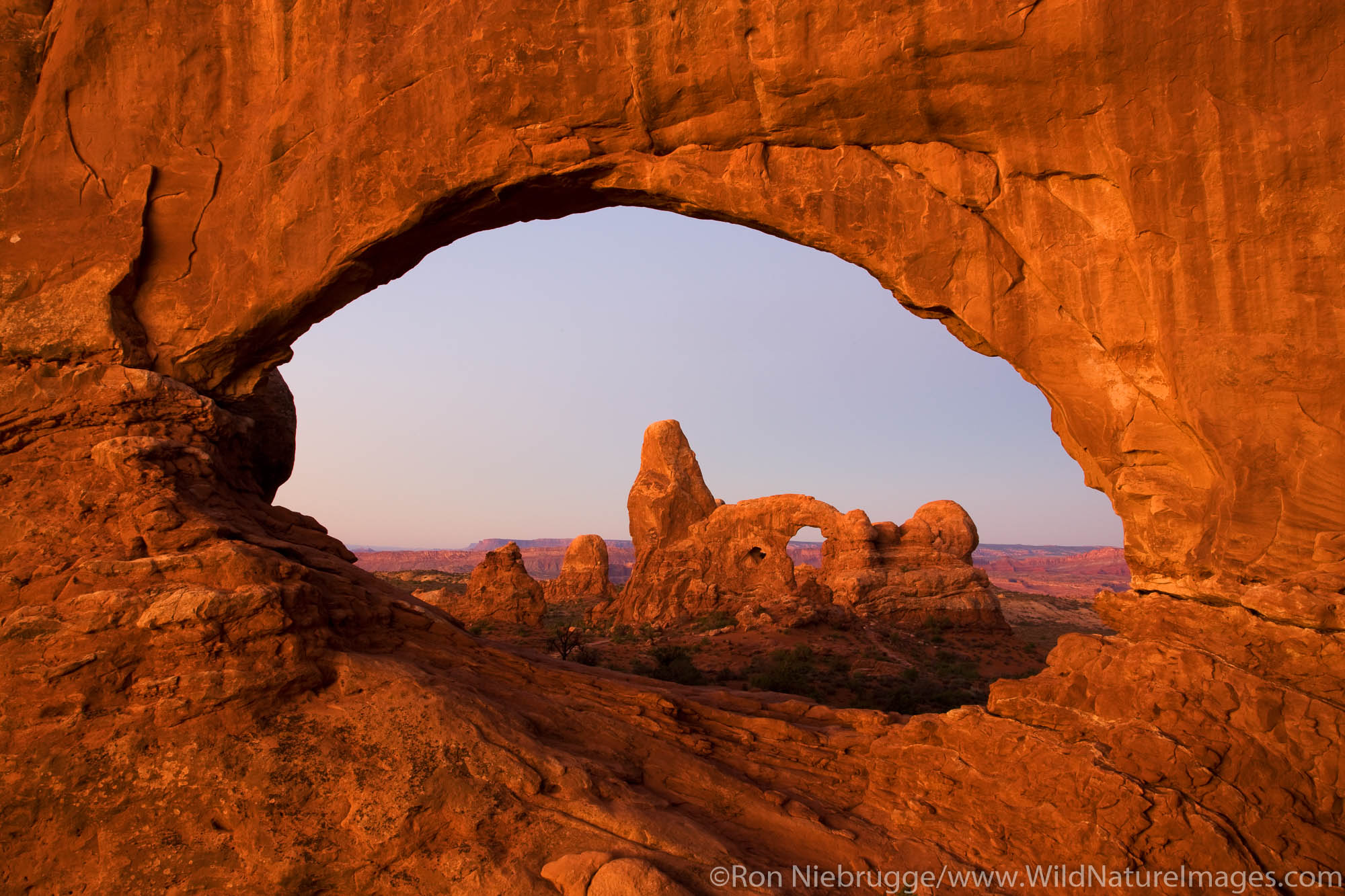 Turret Arch viewed through North Window, Arches National Park, near Moab, Utah.