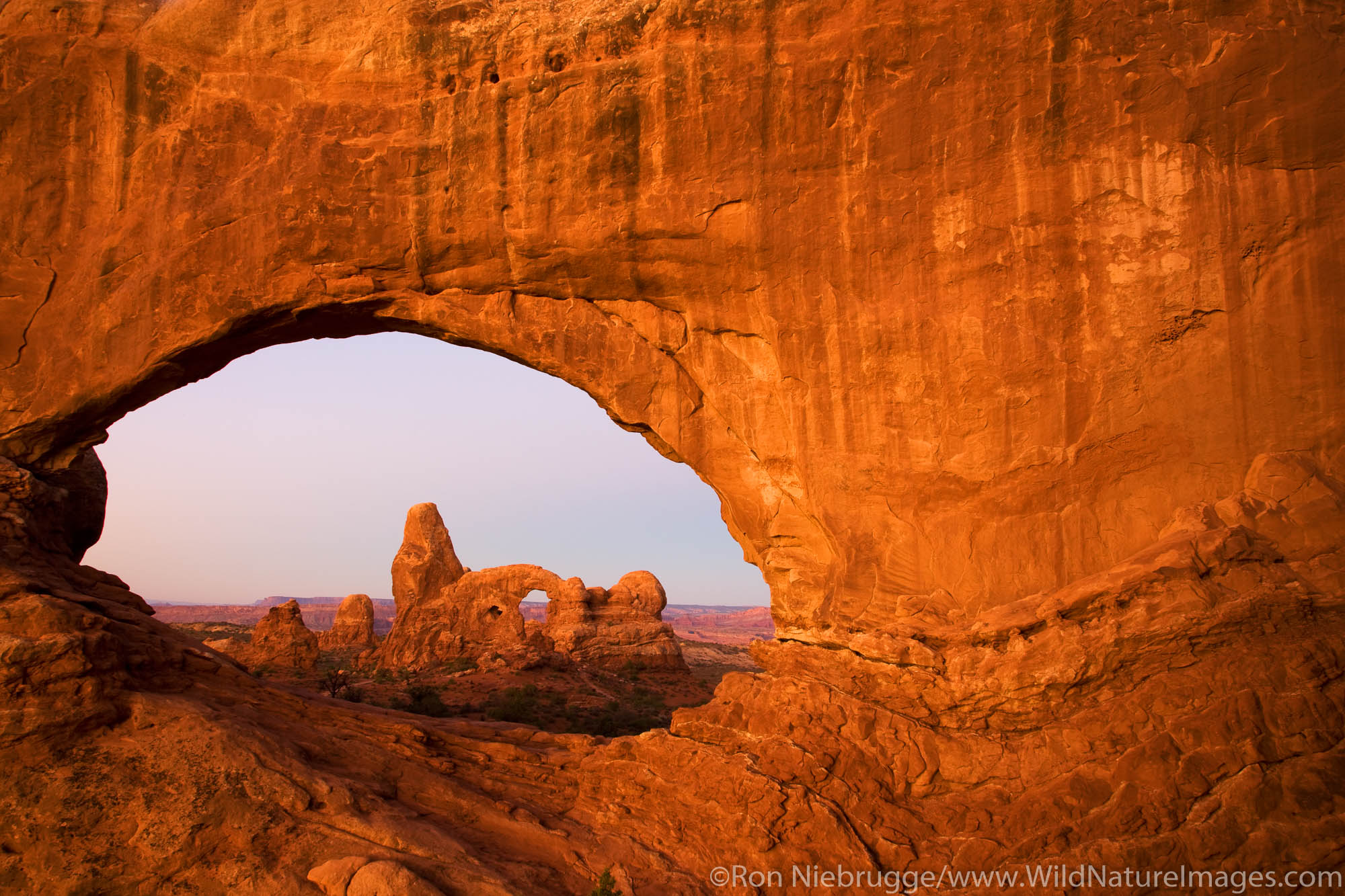 Turret Arch viewed through North Window, Arches National Park, near Moab, Utah.