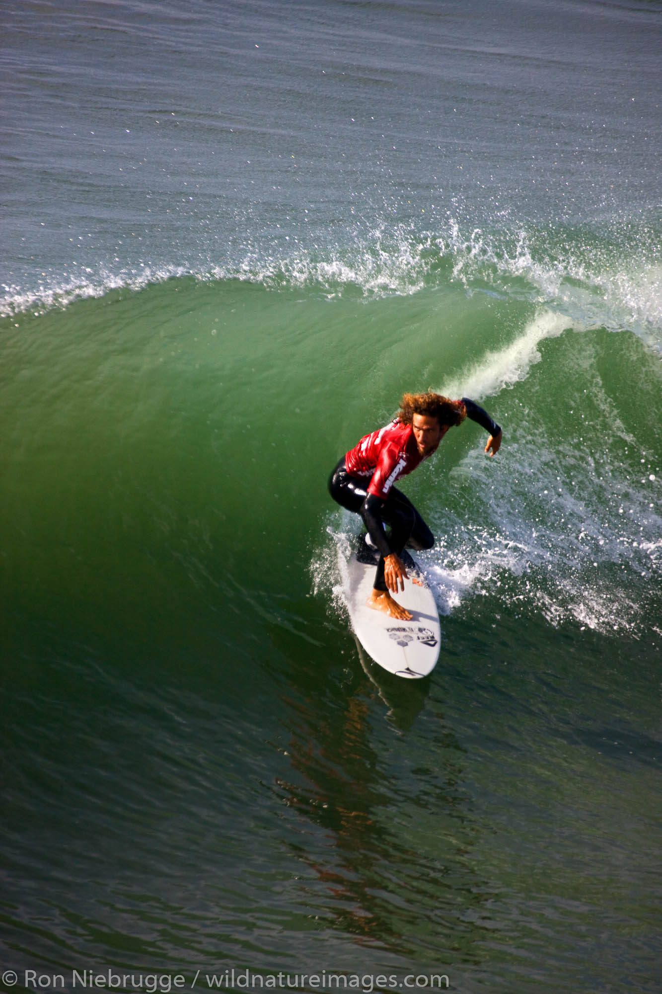 Rob Machado competing in the Katin Pro/Am surf competition at Huntington Beach Pier, Orange County, California.