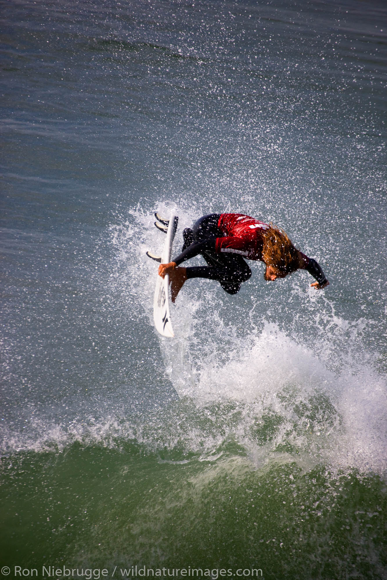 Rob Machado competing in the Katin Pro/Am surf competition at Huntington Beach Pier, Orange County, California.