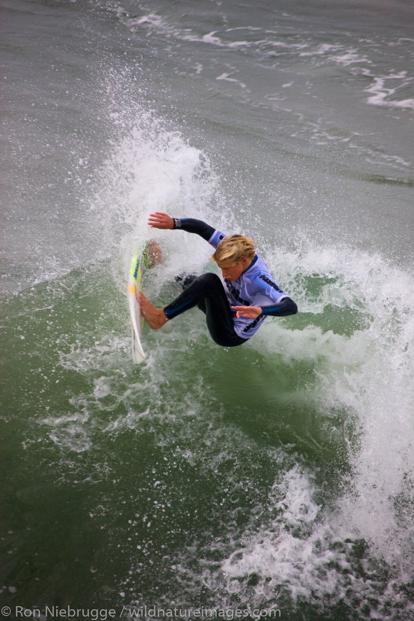 Kolohe Andino competing in the Katin Pro/Am surf competition at Huntington Beach Pier, Orange County, California.