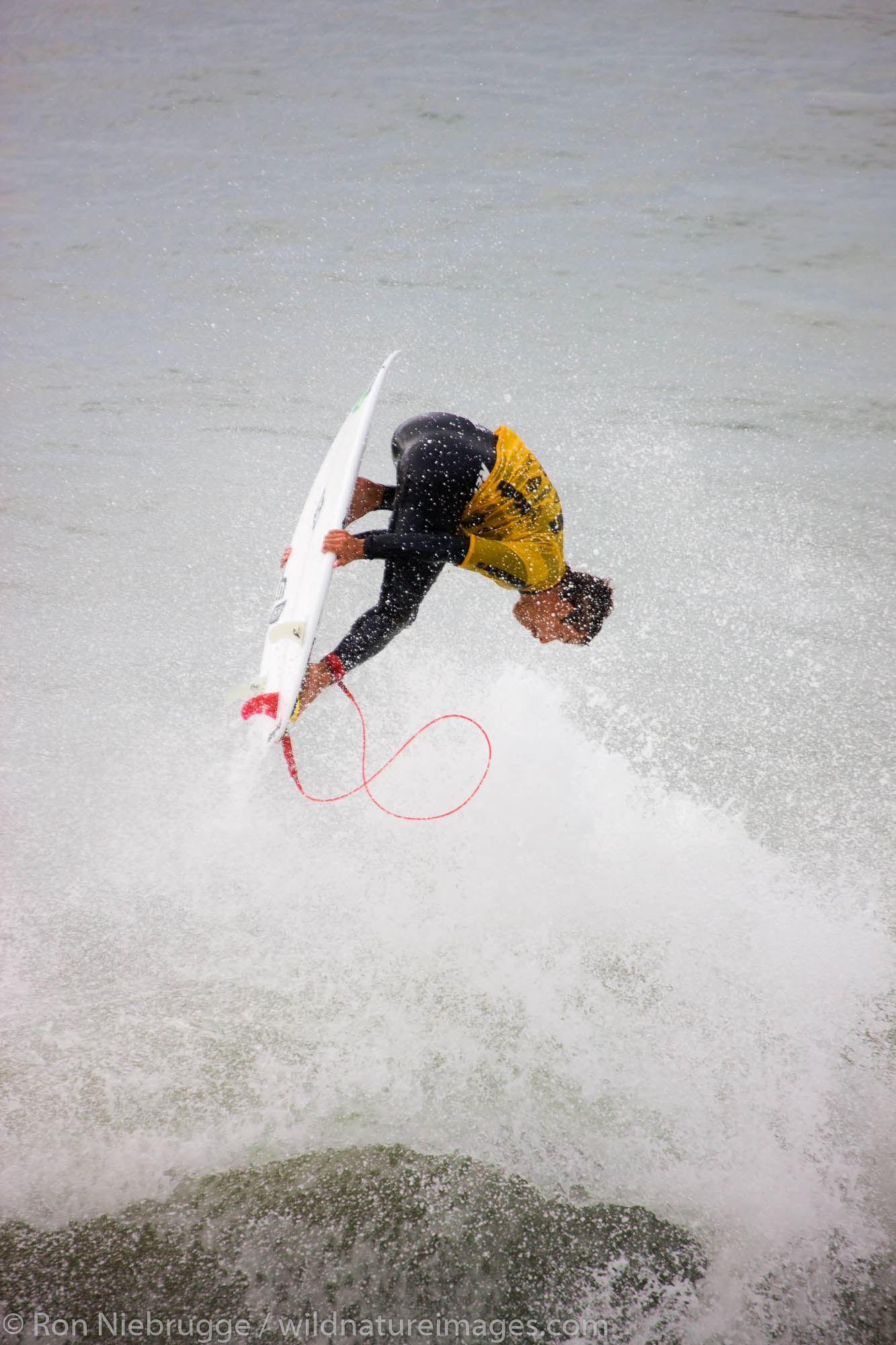 Chris Waring competing in the Katin Pro/Am surf competition at Huntington Beach Pier, Orange County, California.