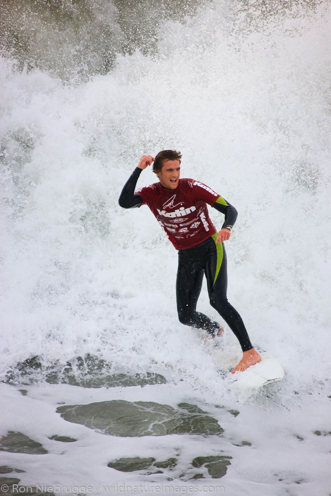 Brett Simpson competing in the Katin Pro/Am surf competition at Huntington Beach Pier, Orange County, California.