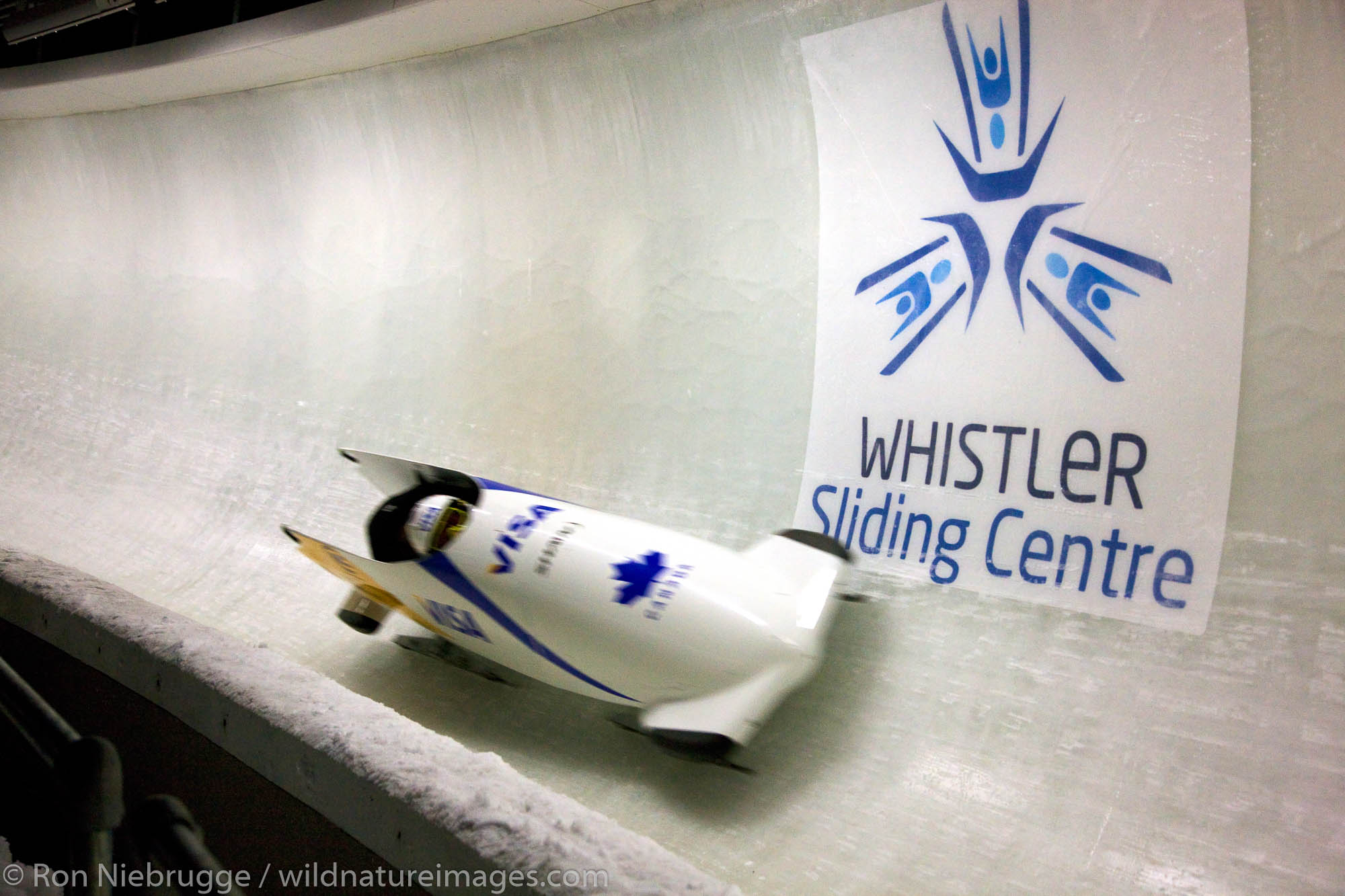 A bobsled during a World Cup practice at the Whistler Sliding Centre, a sports venue for the 2010 Vancouver Winter Olympics...